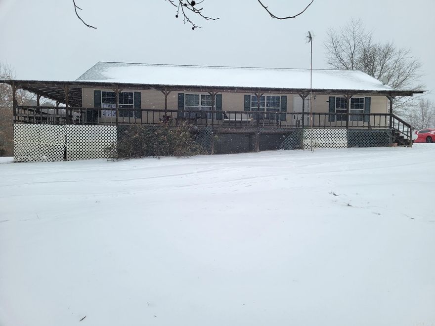 Four bedroom Two Bath home on over 11 acres mostly wooded. House is a split floor plan. Tile and Lvp Flooring.  House has a wrap around porch Nice 30x40 shop with 12 ft walls and two 10 ft roll up doors. Call for more details