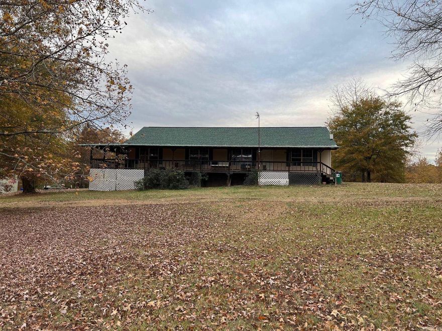 Four bedroom Two Bath home on over 11 acres mostly wooded. House is a split floor plan. Tile and Lvp Flooring.  House has a wrap around porch Nice 30x40 shop with 12 ft walls and two 10 ft roll up doors. Call for more details