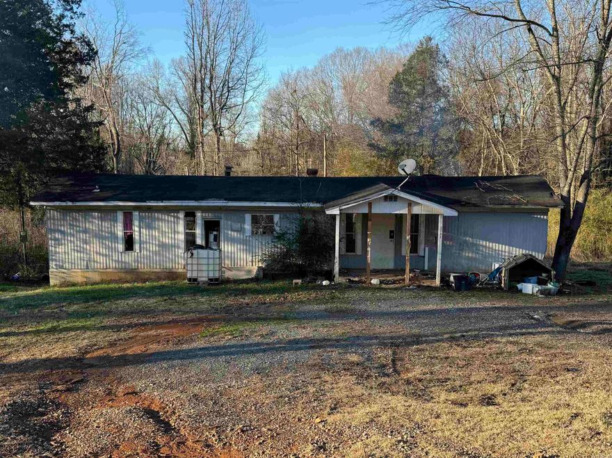 Investment opportunity on a large half acre lot on the outskirts of Conway. Fix up the mobile home or remove and build to suit. Electric and septic available on property. A well will need to be installed for water. Agents See Remarks
