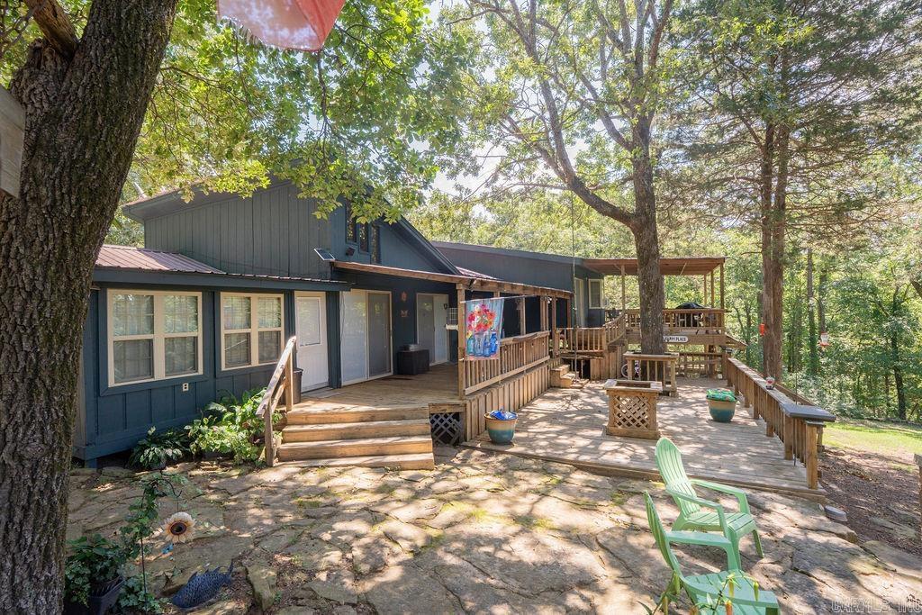 If you are looking for a getaway this is it!!!! Unique property, house on lake with 2 extra lots and a shared 2-slip boat dock. This property is perfect for a lake getaway for large family or a full time residence with mother in law quarters! Priced to sell!!!!