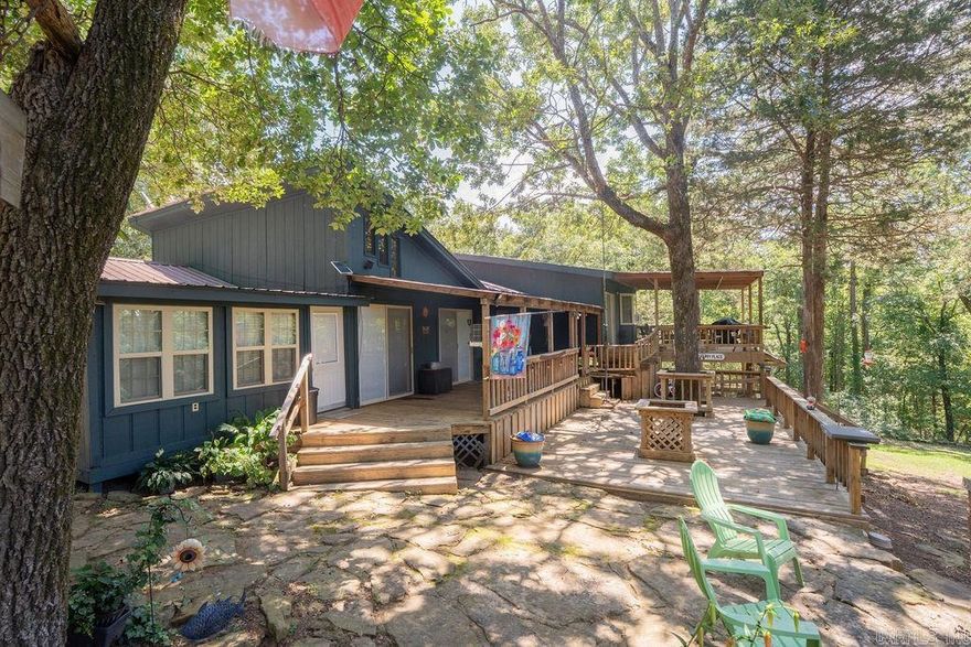 If you are looking for a getaway this is it!!!! Unique property, house on lake with 2 extra lots and a shared 2-slip boat dock.  This property is perfect for a lake getaway for large family or a full time residence with mother in law quarters!  Priced to sell!!!!