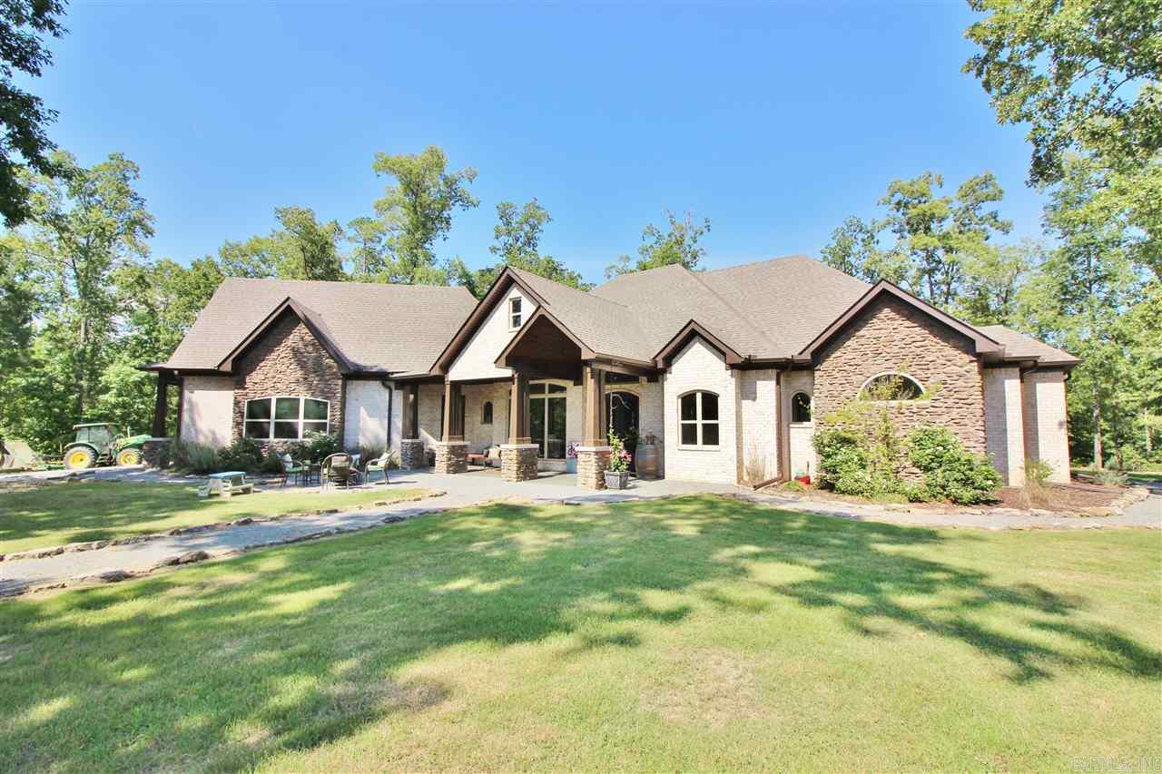 WOW... Exquisite Beauty / Private Setting....Amenities Include: Approx. 4480 sf Custom Home, 4 Bedrooms, 3 1/2 Bathrooms, Family Room w/fireplace, Hearth Room w/fireplace, Breakfast Room, Formal Dining Room, Office/Study w/Wet Bar, Large Master Suite w/Custom Tile Walk-in Shower, Mudroom, Laundry Room, Upstairs has Bedroom with Full Bathroom and extra Bonus Room Area, All sitting on 80 acres partially cleared but very private, Benton Schools, and Much, Much More... An additional 35 acres Could be purchased.