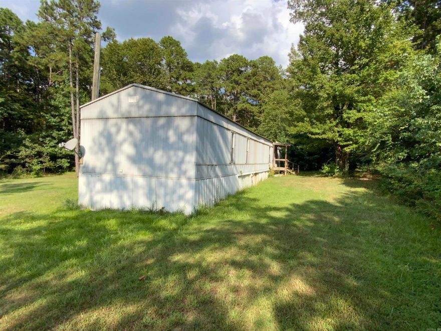 Priced to sell! This 2 bedroom 2 bath mobile with almost an acre of land Minutes to Tumbling Shoals Recreation area and Greers Ferry Lake. Call today!