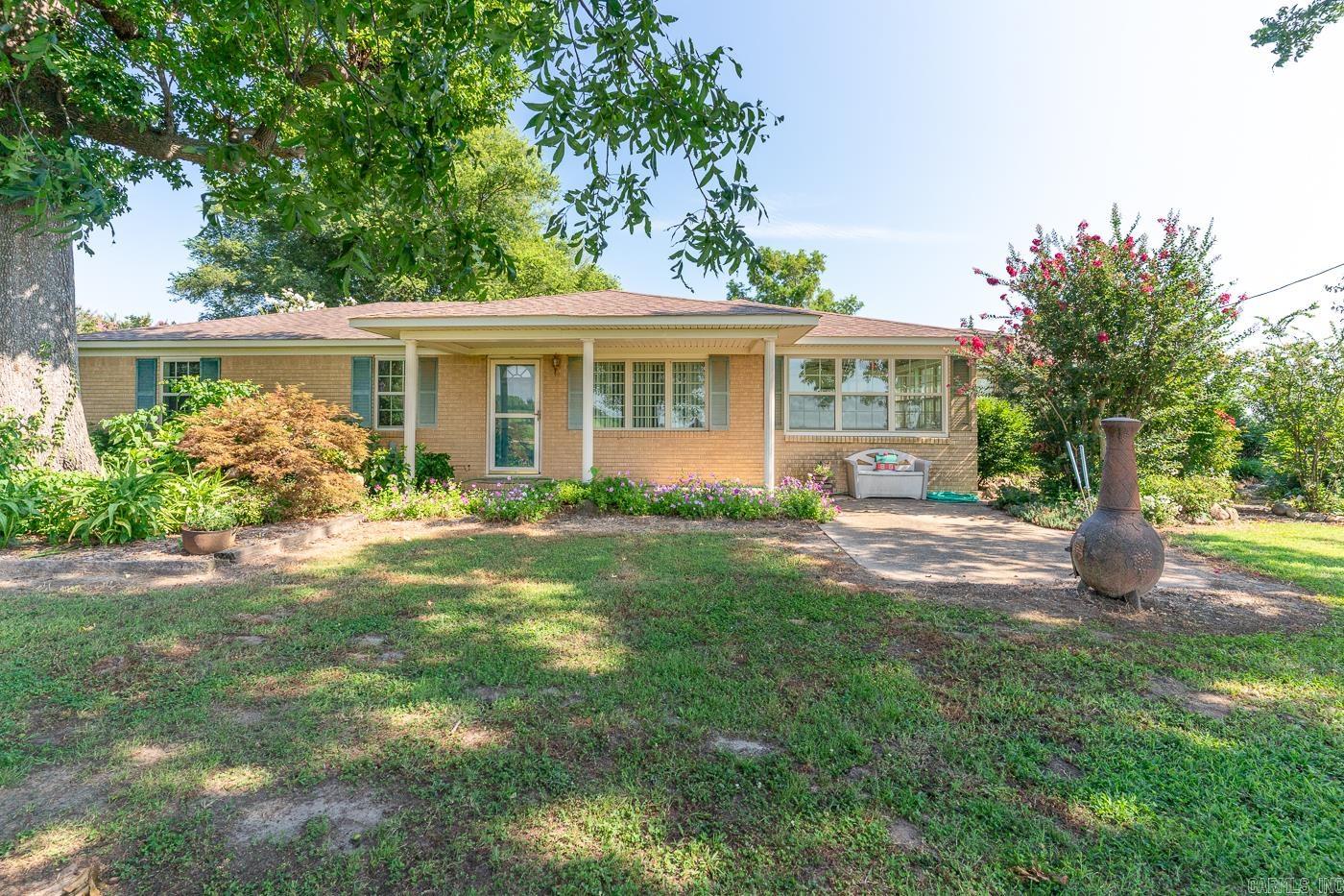 Welcome to the market 237 CR 882, this lovely Ranch style home is in the Riverside School district and sits just on the outskirts of Caraway, Arkansas. The home has 1822 sq ft. and has an open floor plan. There are 4bedrooms and 2 bathrooms along with a lovely sun room. The master has a walk in closet as well as a large master bath with a jet tub. There is also dining room just off of the kitchen. This property features a brand NEW ROOF & HVAC!! The garage has tons of storage and plenty of work space. There are 2 outbuildings (8x10 & 12x16) providing plenty of storage for yard equipment, among other things! This property sits on a an acre of ground with a multitude of fruit & shade trees! There is also a koi pond available with electricity available to the pond. You can sit on the front porch and enjoy peace in quiet. Don't miss out on this opportunity to make this home yours! Call your favorite agent today to schedule a showing!