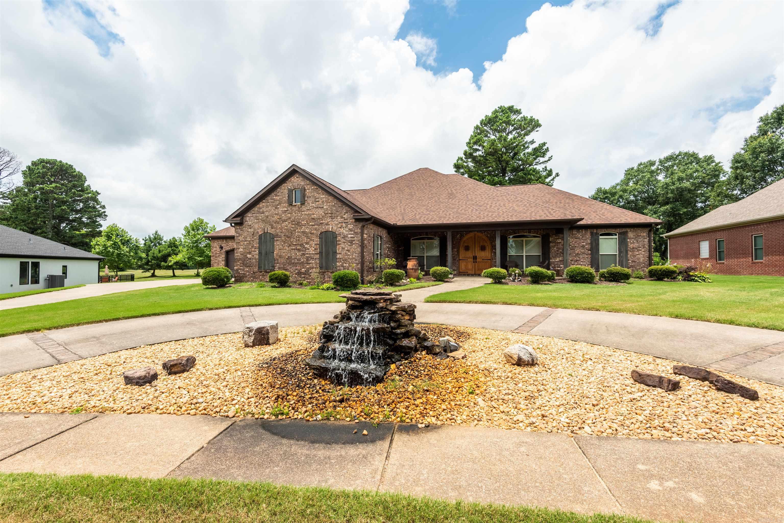 Custom-Built Home on Longhills Golf Course!This meticulously crafted, one-owner home boasting unparalleled elegance and thoughtful design throughout. Step inside to discover crown molding adorning every room, solid wood custom built kitchen cabinets, pullout shelve for electric mix with electrical outlet, accentuating the impeccable craftsmanship and attention to detail. A spacious 12'x20' bonus room upstairs provides flexibility for your every need. For the hobbyist , an insulated garage/shop awaits, ideal for projects or extra storage. Enjoy outdoor entertaining with ease on the expansive patio area featuring a built-in Jen-Aire stainless steel grill, complemented by convenient water and electric installations. Relax and unwind on the inviting 8ft wide front porch, perfect for enjoying morning coffee or evening sunsets. This residence seamlessly blends indoor and outdoor living, while being close to everything Benton and Bryant has to offer..Don't miss out on the chance to make this exceptional property yours. Schedule your private tour today