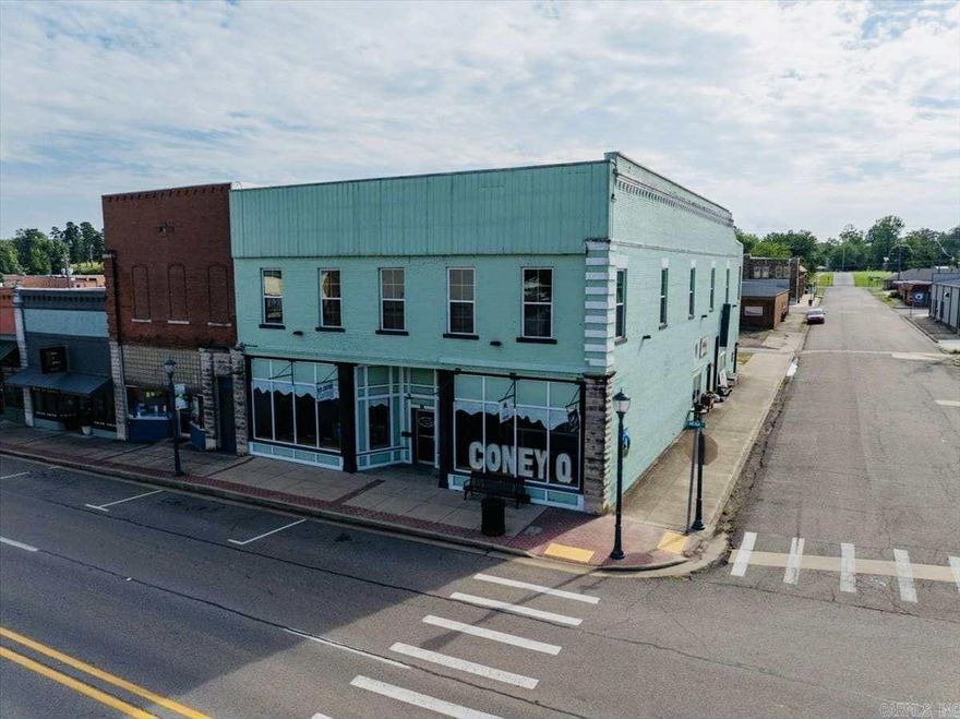 Looking for an inspiring investment opportunity in The heart of Mena? This one of a kind, beautifully restored, HISTORIC 2-story building is brimming with opportunity! Currently home to multiple income generating businesses, this building has so much to offer and even more potential!   Step inside and you’ll see a BEAUTIFUL, spacious storefront currently operating as an ice cream shop. With floor to ceiling windows, original hardwood floors, two bathrooms, and a unique upstairs loft space, there is no other building in town with this level of historic charm! Upstairs you’ll find a gorgeous DANCE STUDIO currently being used for yoga and dance classes.   On the first floor there are 2 additional retail spaces which are currently occupied, as well as a large storage room.   The building also includes a completely renovated 2bed/2bath fully furnished SHORT TERM RENTAL LOFT with a spacious deck and hot tub!   With so much anticipated growth in our tourism sector, this building could be an excellent investment for the right buyer!