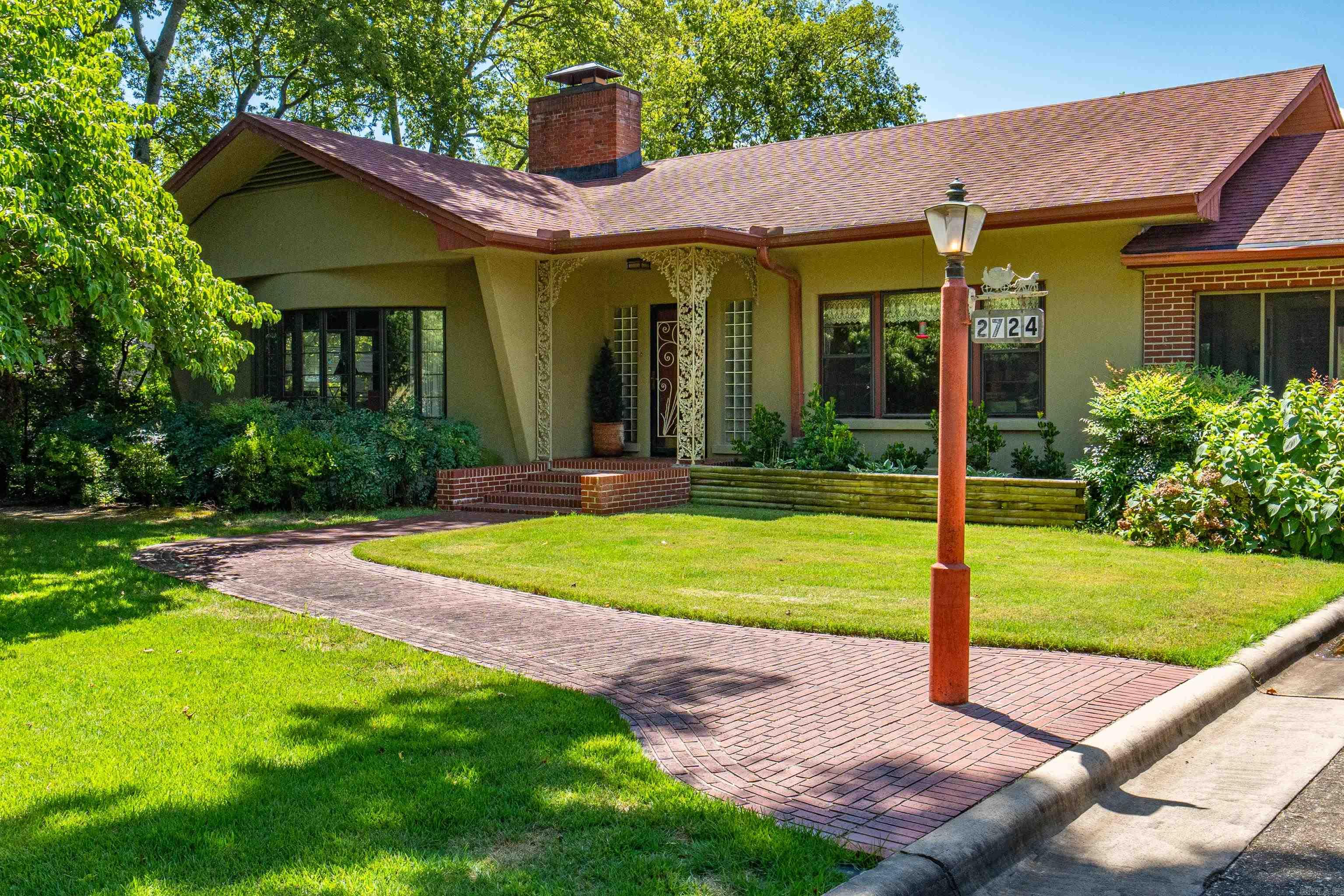 Welcome to this charming historic home, where comfort and functionality come together beautifully. On the main level, you'll find a lovely formal living & dining area with gorgeous hardwood floors & a cozy fireplace on each floor, creating a warm & welcoming atmosphere. The main level also features two spacious bedrooms and a cozy office. Just off the large kitchen, a bright sunroom provides the perfect space to unwind and enjoy a cup of coffee. Downstairs, the home expands with a fantastic bonus room, and a 3rd bedroom. There is also a second living area with a barāideal for casual get-togethers. You'll appreciate the convenient indoor, temperature-controlled storage area that makes organization a breeze. Step outside to your very own private oasisā a beautifully gated swimming pool with added privacy on both sides. The large lot offers endless possibilities, whether you're looking to add extra storage or create the ultimate clubhouse. With both a one-car carport and garage, parking is easy and convenient. This home is centrally located offering a peaceful retreat while still being just minutes away from schools, shopping, and healthcare facilities.