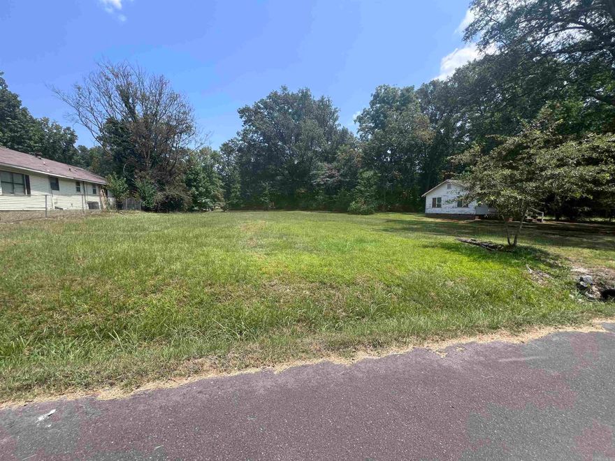 Beautiful flat lot. Double wide mobiles are allowed with city water/sewer. Buyer to verify. Great rental development opportunity or build/place your own home!