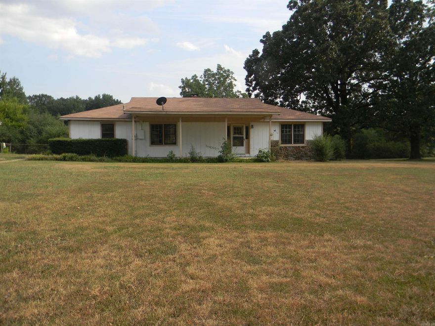 Welcome Home!!  Come on out and take a look at this home west of town sitting on 1.53 acres.  Outside the city limits but still close to town. New roof put on in 2021, new HVAC installed in 2023 and beautiful original hardwood floors.  New storm windows installed and a spacious sun room added on to host all your family gatherings.  Front room can be used as a bedroom or a second living room and 4th room can be used as an office or made into a 4th bedroom.  Call today for your personal tour.