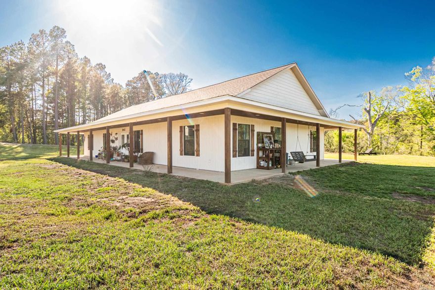 Escape to your own private retreat on 6.76 acres just a few miles outside El Dorado! This 2023-built modern ranch blends sleek, contemporary design with charming farmhouse touches. Featuring 4 spacious bedrooms and 2 full bathrooms, the open floor plan offers abundant natural light, a welcoming living area, and a stylish kitchen perfect for entertaining. Enjoy serene views, outdoor space for gardening or play, and the peace of rural living while still being minutes from town. With modern finishes, thoughtful details, and plenty of room to roam, this home is the perfect combination of comfort, style, and rustic living. Don’t miss your chance to make 5842 Grace Lane your dream home!  Call or text Lauren Dugal for showings! 870-562-7774