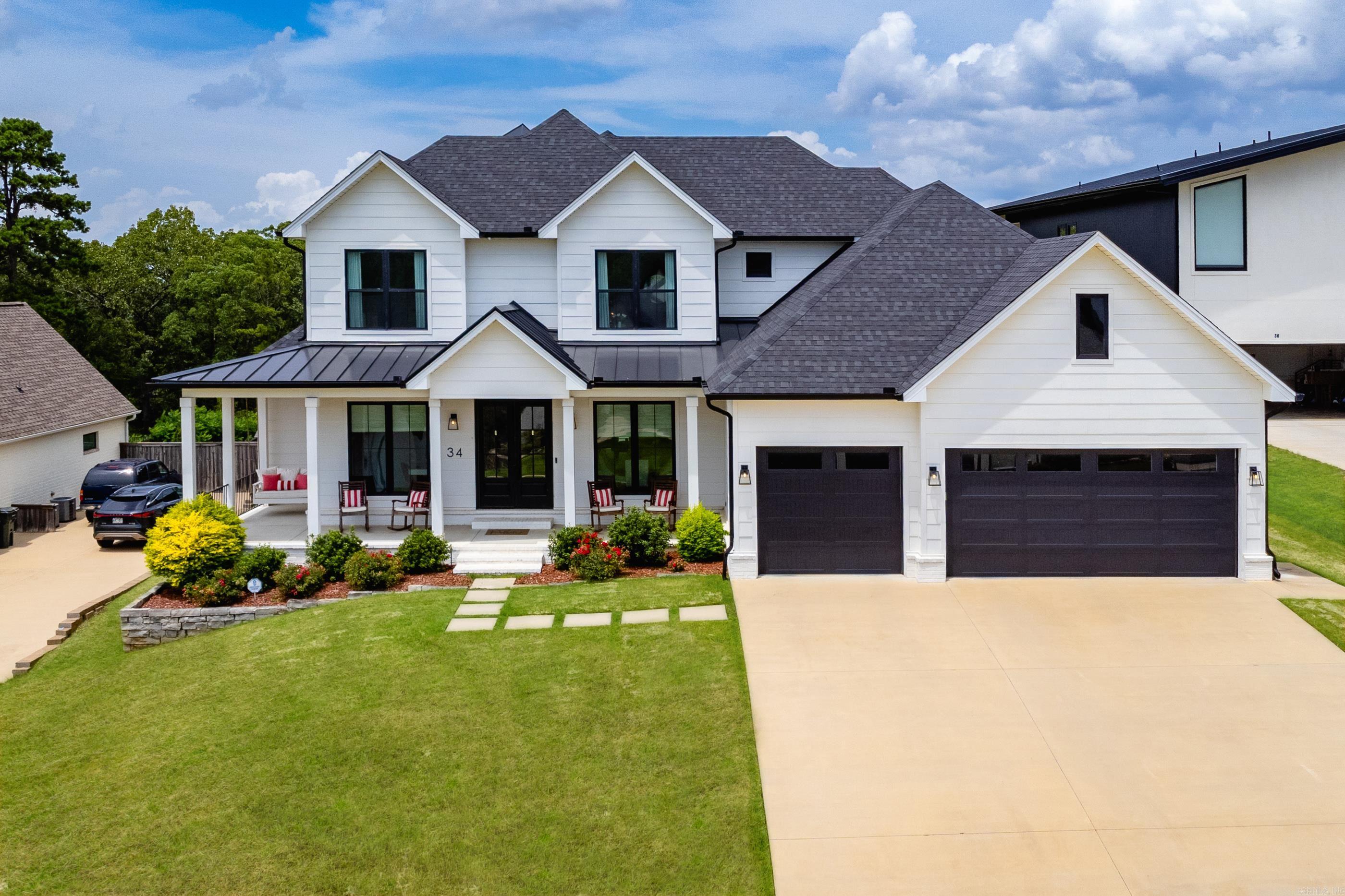 Gorgeous custom two-story home in Falstone with a fabulous layout and designer finishes throughout! The main level features an open floor plan w/ a home office including built-ins & glass French doors leading to foyer, a spacious dining room open to the den and a stunning den/family room with tall ceilings, a gas fireplace, custom trim and built-ins. The gourmet kitchen offers double ovens, a pot filler, gas range, quartz countertops and breakfast nook. Additional main level features include a huge walk-in pantry, laundry room with sink, mudroom cubbies, half bath, private primary suite and guest room with ensuite bath. The primary suite features a spa-like bathroom with soaking tub, double sinks, ample storage and a fabulous walk-in closet. Expansive windows across the back of the home showcase the covered back porch with fireplace and private backyard. Upstairs includes a large bonus room with half bath and two bedrooms connected by a Jack-and-Jill bath. Convenient location near shopping, dining, schools & more! Other features include: wraparound front porch, Hardie board exterior, 3-car garage, security system and over $20K in custom window treatments! See agent remarks.