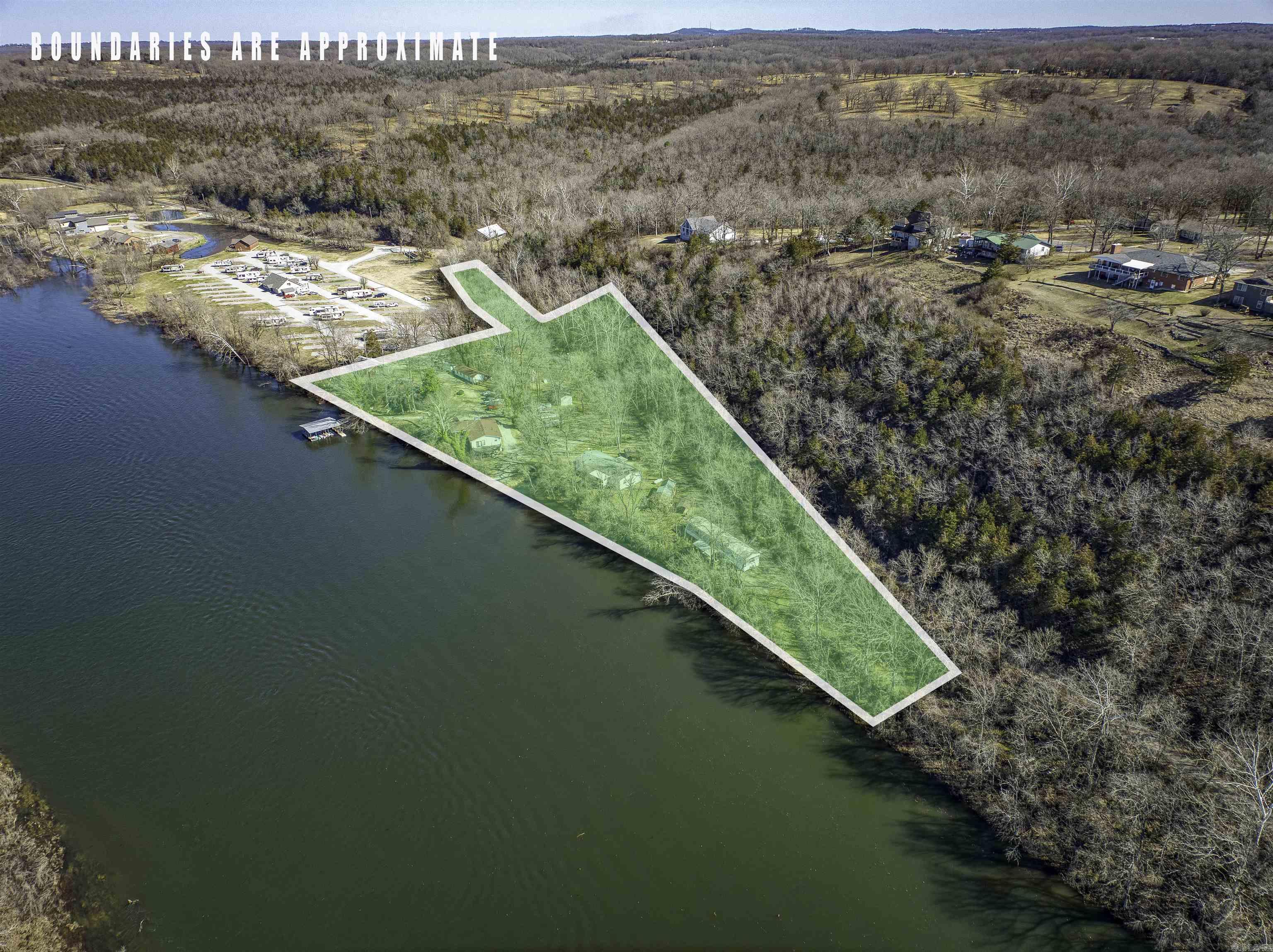 Here's an amazing 12-unit resort property that sits right on the banks of the famous White River. "His Place Resort" has had repeat clientele for the last 20 years for a reason! This 4.55-acre property has over 950 feet of river frontage, and is in a prime location known world-wide for its clear water and trophy trout! There are 12 units that are used as nightly rentals, a main house with an attached office, shop building with laundry and restrooms, 2 boat ramps, and a 6-bay boat dock. Ready for a change of pace in life? Wake up every day on the beautiful White River, and run your own resort and guide service! Property has fiber optic internet