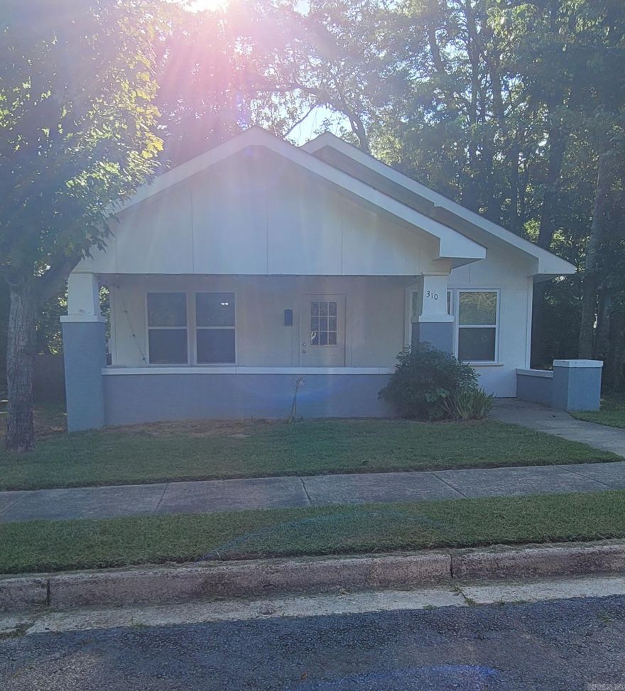 Updated home in downtown Morrilton!! Located in an established neighborhood, this 3/2 home is a must see! Offering a traditional, open style floor plan, some original detailing and a beautiful craftsman style design while showcasing a modern look with that bungalow appeal! Lots of storage throughout the house and attic. The spacious backyard is fenced and includes a 16'x12' storage building with attic space. It is wired for electrical service but it is not connected to the home. You don't want to miss this one! Call or text to check it out today!