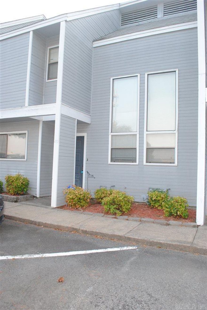 2 Large Bedrooms Upstairs each w/Full Bathroom.  Master Enjoys a Private Deck & HUGE walk-in Closet! W/D upstairs for your convenience.  Foyer w/Coat Closet, Dining Room, Kitchen w/Refrigerator, Living Room w/Fireplace. Storage under Stairway, 1/2 Bath down, Patio and Private Fenced Area w/access to green space for walking your pet. Enjoy the Swimming Pool on Site!!! Updates include Tile Flooring in Kitchen, Dining & Hallway PLUS Hardwood Floors in Living Room!!! Dogs < 30lbs. per Condo Association