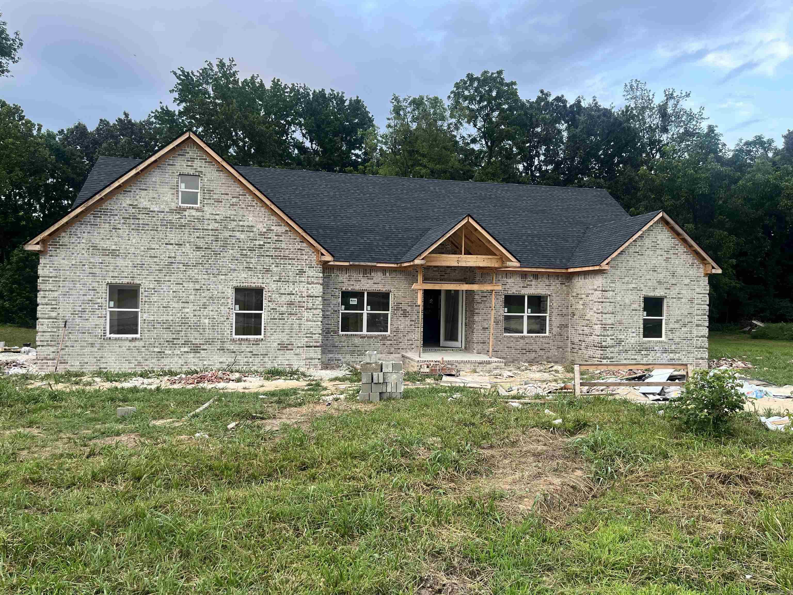 Welcome to your future home! Sitting on just over 1 acre, this one has so much potential and is ready for you to put your finishing touches on it. With around 2,840 sq ft, you'll find 4 bed, 2.5 baths, plus a bonus room that could easily serve as a 5th bedroom. The open floor plan flows perfectly-the kitchen, dining, and living areas were designed for gathering and entertaining. As you enter, you'll notice the spacious foyer and large windows filling the living room with natural light. The vaulted ceilings will be lined with beautiful wood beams, adding a warm, rustic touch. And since it's unfinished, you still have the opportunity to select your paint colors and make it truly yours! The kitchen will feature quartz countertops, custom cabinets, black light fixtures, and stainless appliances. Plus, a huge walk-in pantry you won't want to miss. The oversized laundry room sits just behind the kitchen, along with stairs leading to the upstairs bonus room. On one side of the home, you'll find the master suite, while the other side offers three additional bedrooms and a full bath. Call today to take your tour!