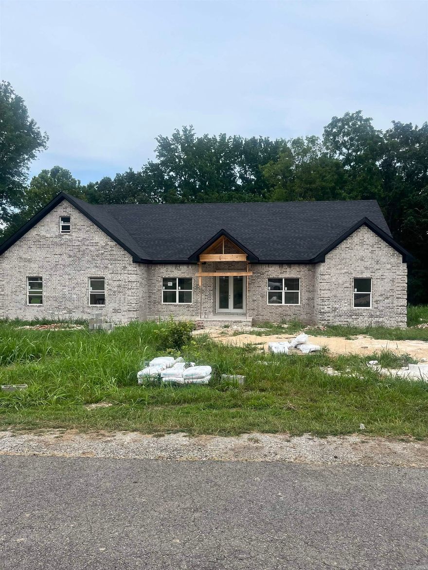 Welcome to your future home! Sitting on just over 1 acre, this one has so much potential and is ready for you to put your finishing touches on it. With around 2,840 sq ft, you'll find 4 bed, 2.5 baths, plus a bonus room that could easily serve as a 5th bedroom. The open floor plan flows perfectly-the kitchen, dining, and living areas were designed for gathering and entertaining. As you enter, you'll notice the spacious foyer and large windows filling the living room with natural light. The vaulted ceilings will be lined with beautiful wood beams, adding a warm, rustic touch. And since it's unfinished, you still have the opportunity to select your paint colors and make it truly yours!  The kitchen will feature quartz countertops, custom cabinets, black light fixtures, and stainless appliances. Plus, a huge walk-in pantry you won't want to miss. The oversized laundry room sits just behind the kitchen, along with stairs leading to the upstairs bonus room. On one side of the home, you'll find the master suite, while the other side offers three additional bedrooms and a full bath. Call today to take your tour!