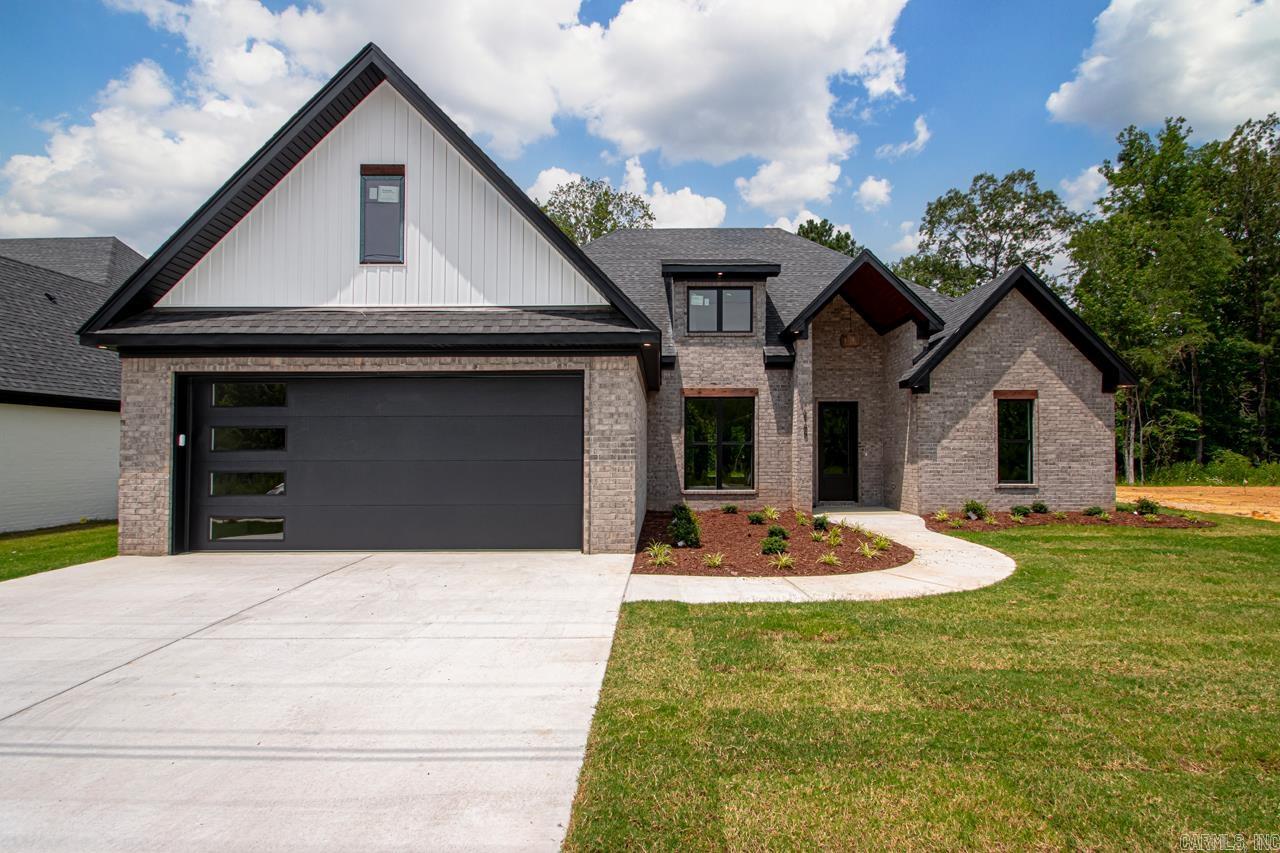 This new construction in Creekside offers 4 bedrooms, 2.5 baths, and the perfect mix of traditional charm and modern style. Vaulted ceilings, custom finishes, and an open layout make the home feel bright and welcoming. The kitchen features custom cabinets, beautiful countertops, a gas stove and flows into the living room, where a centrally placed gas fireplace creates a cozy focal point. The split floor plan offers privacy, the primary suite is spacious, and there’s plenty of storage throughout. Enjoy a covered patio and private backyard in one of Bryant’s most sought-after neighborhoods. Come see today!