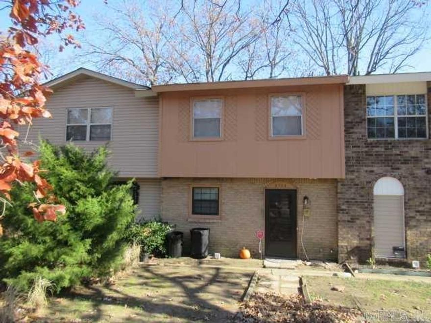 Investors or individual looking for large townhouse. Ideal location, near Pulaski Tech, hospitals, medical facilities, shopping and restaurants. Three bedrooms upstairs with full bath. Master is huge! Nice size living room, half bath, kitchen and dining room downstairs, all with newer flooring. Home has separate entry and patio. Parking located in front of unit.