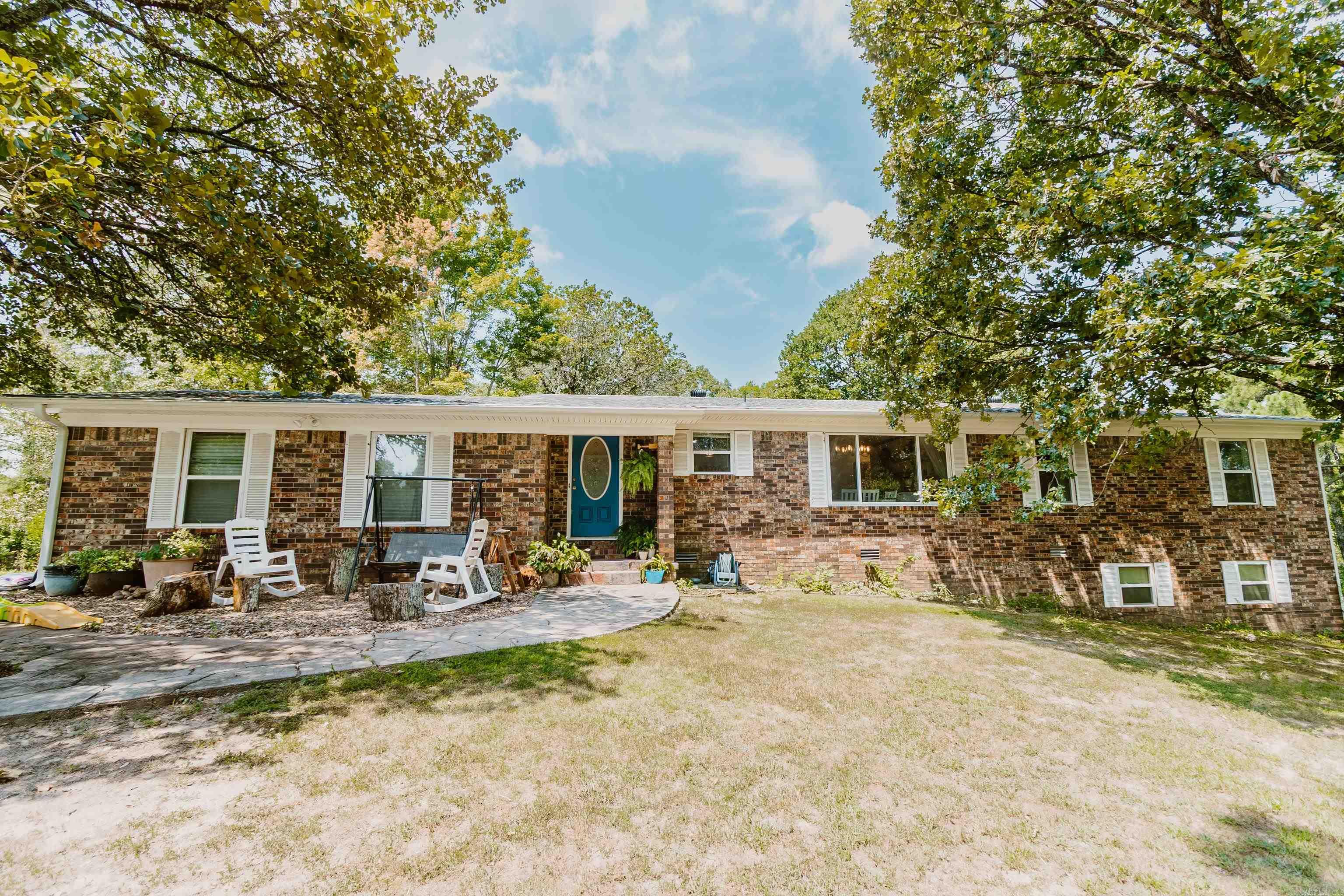 Welcome to this beautiful 4/3 home sitting on 2.2 acres. This home has everything you need. Large living room with one of a kind wood burning stove great for winter nights and entertaining. Spacious kitchen with granite countertops, 6 year old appliances, a beautiful copper farm sink, separate pantry and plenty of cabinets. The kitchen also has a breakfast bar area and opens into a good size dining area. 3 bedrooms upstairs allows for plenty of choices and the primary bath sports a nice walk-in shower. The basement is a great place for a mother-in-laws suite that includes a small living area, full bath with walk-in shower and lots of closet space. The back porch stretches across the back of the house with lots of room for outside entertaining. There is a 12X32 shop and 2 smaller out buildings that convey with the property as well as a tree house.