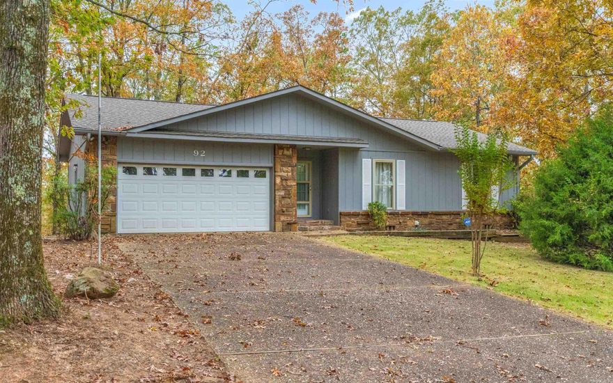 Seeking your own private retreat? You have found it! This charming one-level home with a serene winter mountain view boasts of peaceful solitude with no neighbors insight! However, it is also located just 2 miles from the Cortez Golf Course and Putterz Restaurant, 3 miles from the Cortez Lake launch ramp, 5 miles from the HSV police department and ambulance service, and just 7 miles from Brookshires grocery store.  So, you are able to enjoy your privacy, but also have the security of knowing that modern conveniences are just minutes away!  Step inside to discover a gorgeous natural stone fireplace, large living room, and a spacious sunroom. The garage offers extra storage.The primary suite has its own bathroom and large closet. Sit on the back deck and find the perfect place for bird, deer, and furry friend watching. Please note that some updates are needed to fully realize the property's potential. Seize this opportunity to affordably create your dream home in this private/peaceful location. $1500 New Member Buy-in Fee due at closing.