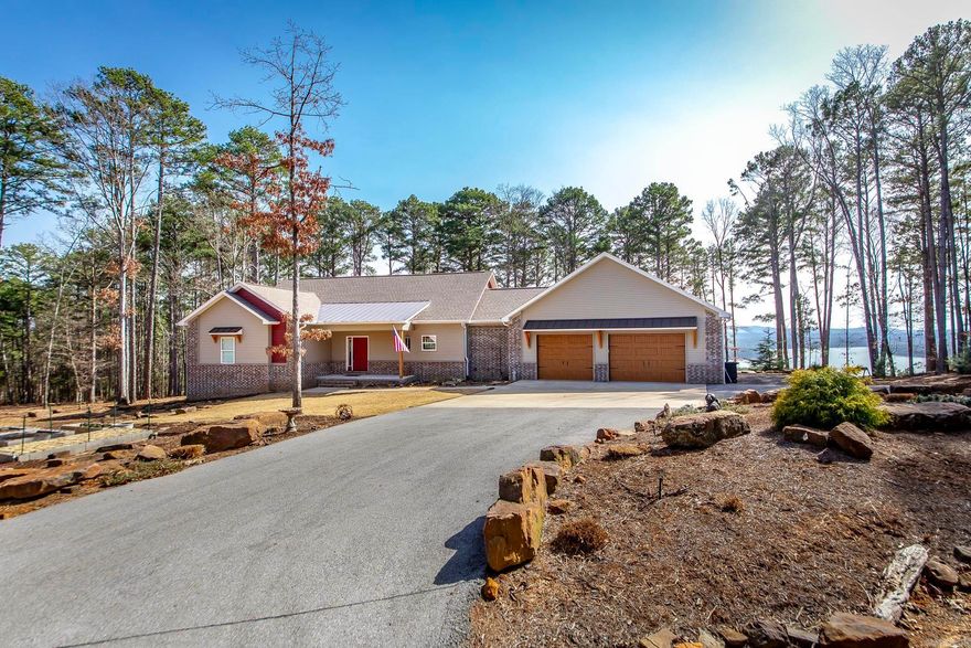Stunning Panoramic View in Convenient Location.This custom home (by T-1 Construction) sits on 2.75 acres overlooking Greers Ferry Lake & only 1 mile from the county boat ramp.Exterior features include outdoor shower, hot tub, perennial landscaping w/irrigation in front yard & raised garden area.The oversized 2 car garage has large storage room & extra parking just out the side door. Transfer switch & gas line already in place for generator. Interior features include open floor plan w/ large windows, granite counters, LVP flooring, 3 bedrooms and 2-1/2 bath on main floor.Master has walk in tile shower.PLENTY of large closets throughout.The laundry room includes a tile dog bath/utility sink & plenty of storage.Real wood stairs lead to the walkout basement which has sealed concrete floor, a full bath, walk in Tornado SafeRoom which doubles as closet for the bedroom area.You will enjoy relaxing on the spacious covered deck, grilling on the upper open deck or catching some rays on the open deck below.All appliances & televisions convey. See documents for list of furnishing included with the home.FFB dues are only $112/mth & include trash p/u, pickle ball/tennis courts,3 pools, & more.