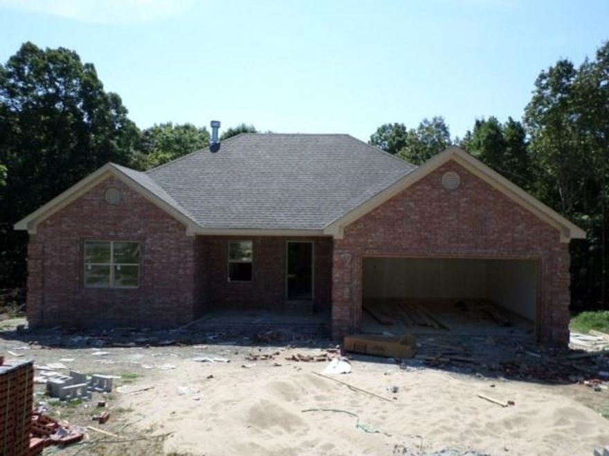 New Construction. Eligible for 100% Rural Development Financing. Living area has 10' ceiling & is open to kitchen & dining. Wood burning FP, hardwood floors, & crown molding highlight the room. Kitchen has custom cabinets, w/granite counter tops, bar & pantry. Ceramic tile floors in dining, kitchen, baths, & laundry. Master bath has sep shower & whirlpool tub. Master BR has pan ceiling & large walk-in closet. Split floor plan. Two large secondary bedrooms. Covered back deck. Approx 1 acre in Bryant Schools.