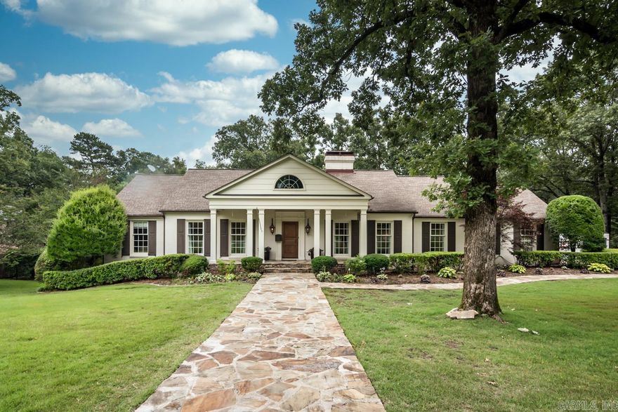 THE PLEASANT VALLEY HOUSE, WE ALL HAVE ADMIRED!!!   This architectural charming home is located on over a three-quarter acre lot, near the entrance to the Pleasant Valley County Club.  This beautiful home has been thoughtfully and carefully remodeled to retain the original charm but designed for a modern family.  The main level features a gracious foyer, sitting room/office, dining room, custom kitchen opening to an oversized great room with vaulted ceiling, family dining and woodburning fireplace.  There is a convenient powder bath just off the great room.  The principal bedroom suite offers a huge walk-in closet and bath.  There is an additional main level bedroom and bath.  On the lower level is a large media/game room and two additional bedrooms and bath.  There is a new Timber Tec deck on the upper level with stairs to the downstairs patio and park like backyard. Additional features include new Marvin windows, driveway, and landscaping. This is a house you do not want to miss.