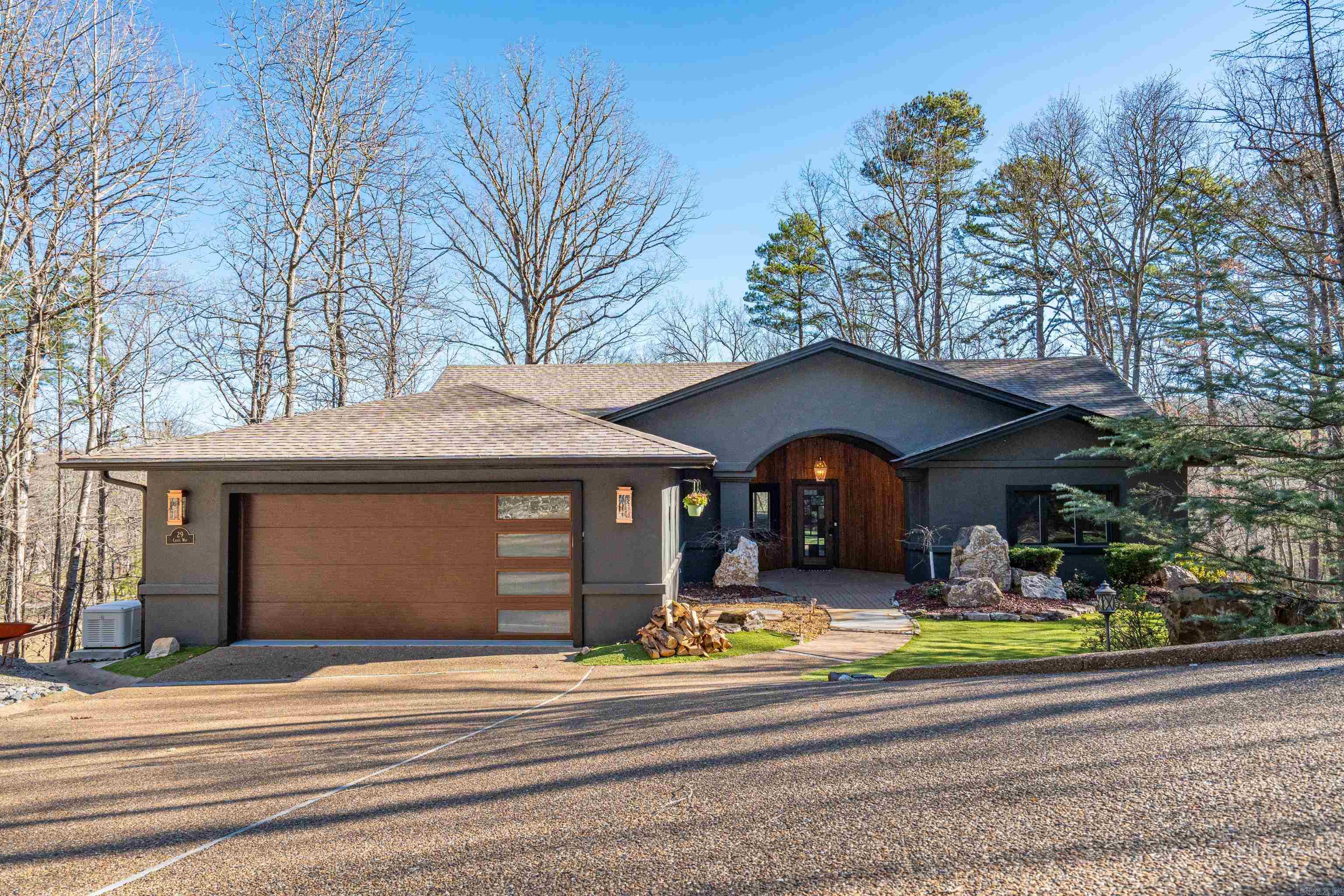 AS GOOD AS BRAND NEW! Welcome home to 29 Ciento Way. Gorgeous views overlooking #4, pond, fountain, and greenway on Cortez Golf Course. Known as "A Shot Maker's Course" and has been ranked #3 in Arkansas by Golf Digest you will enjoy to call this home. Every inch has been meticulously and extensively remodeled and completely re arranged since 2021. Upstairs offers an open concept floorplan with a wall of windows to enjoy the views from every vantage point. The kitchen remodel is impressive and includes "miles" of counter top space, new cabinets, appliances, fixtures, paint, and back splash. The wall of windows in the living room open into each other to allow almost a completely open look. Master suites are on each floor. Upstairs includes an additional bedroom/office. As you stroll downstairs you enter a 2nd living space, living room or kids spaces. It includes a master suite, bar with ice maker and cooler, another bedroom, and a large theatre room that could easily be additional bedroom. Large decks from upstairs and downstairs. Thermal block construction. Easy low maintenance yard and landscaping. AGENT REMARKS