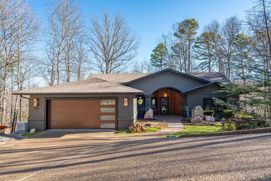 AS GOOD AS BRAND NEW! Welcome home to 29 Ciento Way. Gorgeous views overlooking #4, pond, fountain, and greenway on Cortez Golf Course. Known as "A Shot Maker's Course" and has been ranked #3 in Arkansas by Golf Digest you will enjoy to call this home. Every inch has been meticulously and extensively remodeled and completely re arranged since 2021. Upstairs offers an open concept floorplan with a wall of windows to enjoy the views from every vantage point. The kitchen remodel is impressive and includes "miles" of counter top space, new cabinets, appliances, fixtures, paint, and back splash. The wall of windows in the living room open into each other to allow almost a completely open look. Master suites are on each floor. Upstairs includes an additional bedroom/office. As you stroll downstairs you enter a 2nd living space, living room or kids spaces. It includes a master suite, bar with ice maker and cooler, another bedroom, and a large theatre room that could easily be additional bedroom. Large decks from upstairs and downstairs. Thermal block construction. Easy low maintenance yard and landscaping. AGENT REMARKS