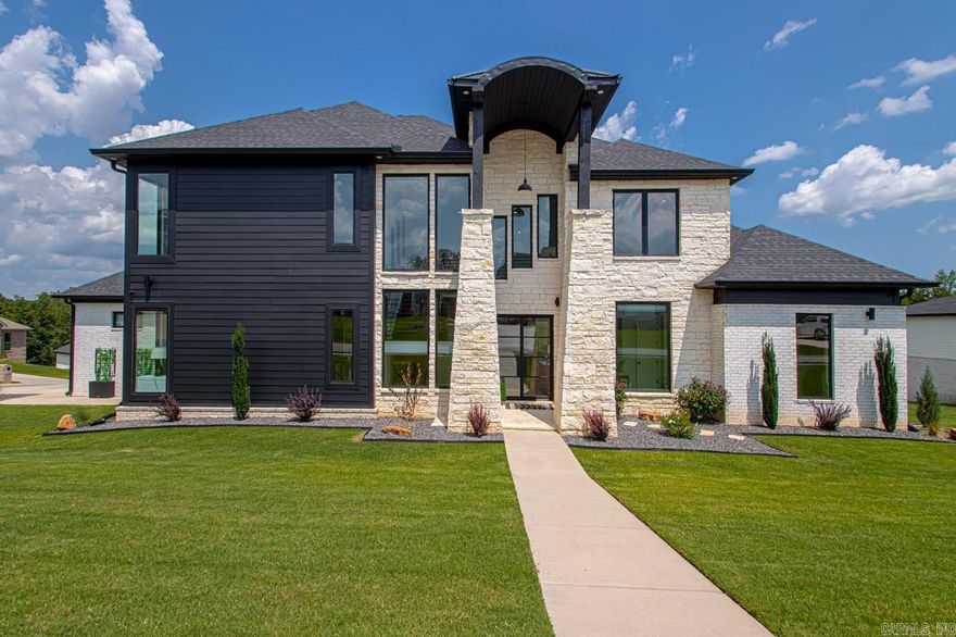 *Price Reduced* Step into luxury with this newly available residence, boasting a dramatic 25-foot ceiling foyer that exudes grandeur. This exquisite home features 5 spacious bedrooms, 4 equipped with en-suite bathrooms, including a lavish primary suite complete with a generous walk-through shower. Cozy up by one of the 4 elegant fireplaces, each adding warmth and charm to the living spaces. Enjoy movie nights in the dedicated movie room, designed for ultimate relaxation and enjoyment. The open-concept living, kitchen, and dining areas offer a seamless flow, ideal for both intimate gatherings and grand entertaining. A large covered back patio extends your living space outdoors, perfect for open air dining and relaxation. The corner lot also features an expansive side yard, providing additional space for outdoor activities. A spacious 3-car garage ensures ample parking and storage. Downstairs features the primary bedroom, a guest bedroom, and a dedicated office. Upstairs houses 3 additional bedrooms and the versatile movie room, offering plenty of space for family and guests. This home combines sophistication with practical elegance. SEE AGENT REMARKS!