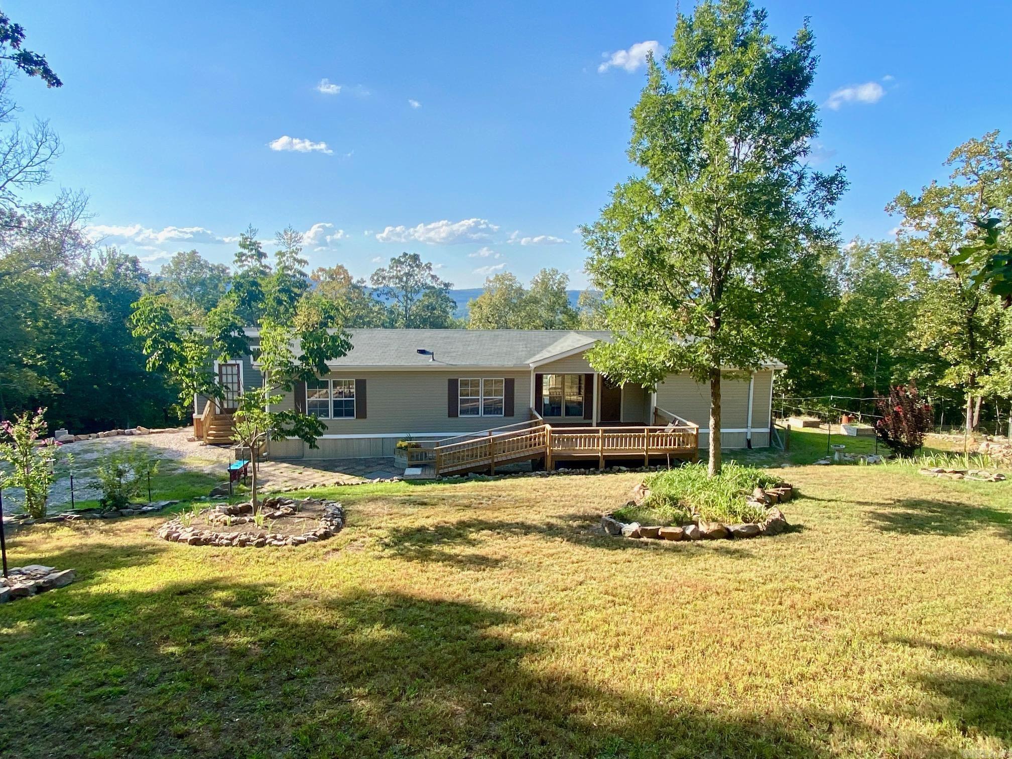 Live your DREAM LIFE in this beautiful Move-in Ready Home, with 3.2 lovingly-maintained acres offering PEACE and PRIVACY! Enjoy gorgeous sunsets and mountain views, plus your own apple, peach, pear, plum and fig trees in the backyard. There's a creek on the east side, and lots of raised beds for your gardening. This lovely 3 bedroom, 2 bath home has a huge eat-in kitchen with an island, and you'll LOVE the wonderful new 168 sf addition with a laundry area, sink, and double oven-a bakers delight or a craft room!(addition not inclcuded in sf!) An awesome workshop is adjacent to the home, as well as a covered 20 foot storage area for cars, boats or just your "stuff". Located at the edge of the famous Most High Loop in Hot Springs, you're 10 minutes from downtown and 5 minutes to the bypass. There is so much to love about this property -from the stunning views, the serenity, and the wonderful layout of the home.... to the feeling you get as you drive down the long private driveway and see your first glimpse of it's dream-like charm. Seeing is believing! Don't let this one get away...it truly is VERY SPECIAL!! FYI- this home will require cash or a 20% down option with a local bank.