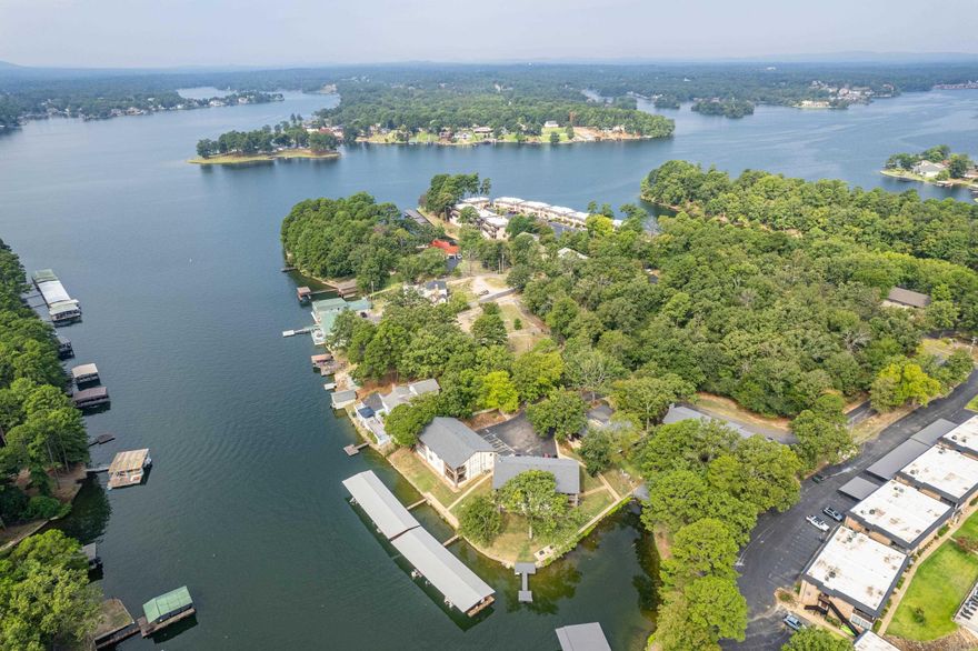 Located in one of Hot Springs’ most conveniently situated condominium communities, this spacious upstairs unit offers an eye-catching view of Lake Hamilton. Enjoy sweeping lake vistas from the outdoor deck, overlooking the main channel with views extending toward Sam’s Pizza. The complex provides a quiet, residential environment and does not allow nightly rentals, making it ideal for peaceful lake living. This is one of the largest units in the complex and has been newly updated throughout. Offered fully furnished, the condo is perfectly suited for an easy weekend getaway or comfortable full-time residence. A boat slip with lift is conveniently located just outside the building, providing effortless access to the water.  An exceptional opportunity to enjoy low-maintenance, luxury lake living in a prime Hot Springs location