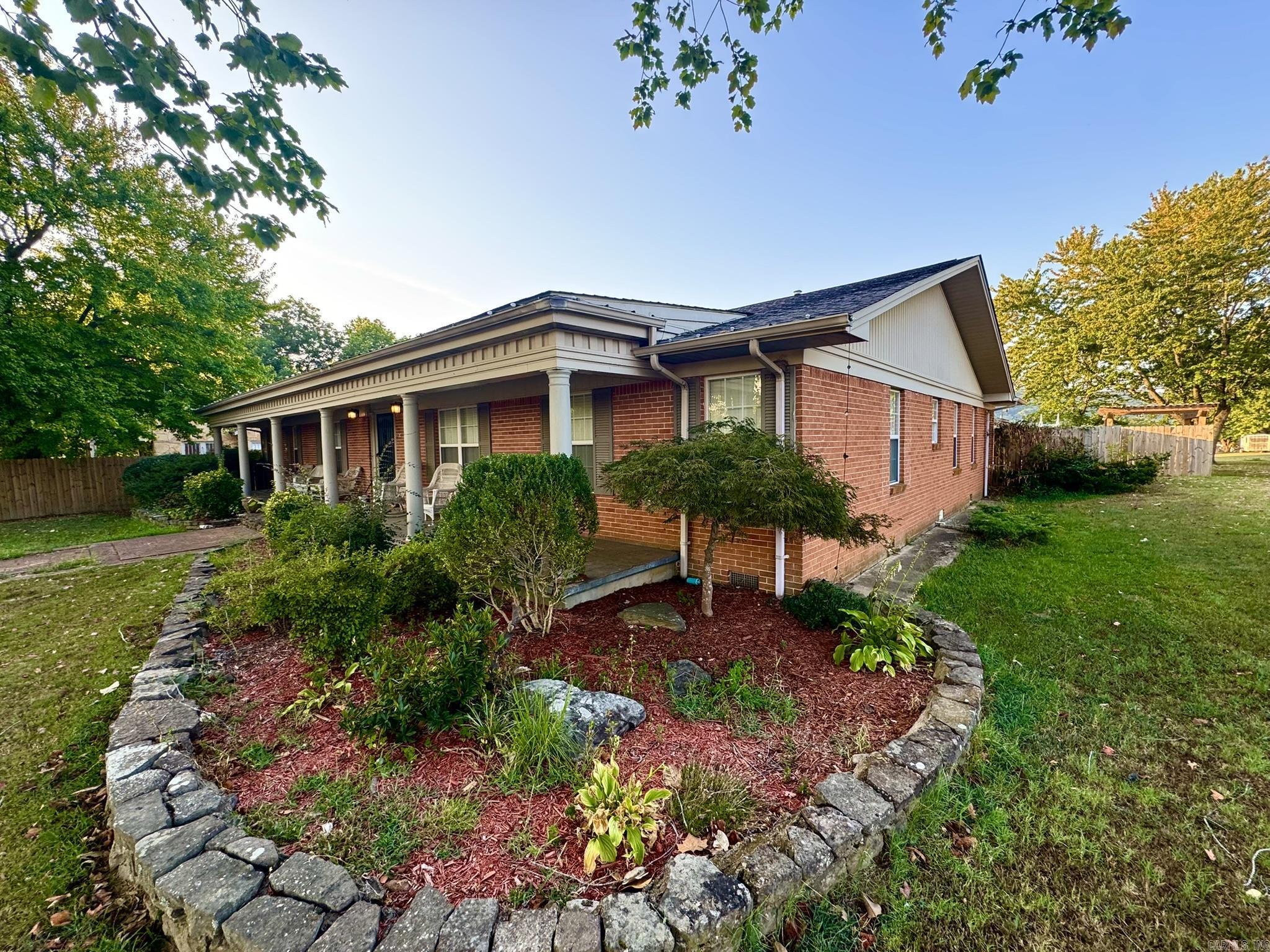 This exquisite 4-bedroom home features 3 full bathrooms and a multi-purpose game room as well as an additional bonus room providing ample space for family living and entertainment. The expansive 3-car garage includes room for workout equipment and an inground storm shelter for added security. The backyard is a tranquil retreat with a fenced-in ground pool that has a new liner installed in 2023, an outdoor fireplace, and stunning mountain views, all set in a spacious concrete backyard area. Indoors, the home is equipped with both wood-burning and gas fireplaces, as well as CH@A creating a cozy and inviting atmosphere. Recent improvements include a new roof and a remodeled bonus room and guest bathroom, adding both style and functionality to the property. This home offers a perfect blend of luxury, comfort, and peace of mind. Conveniently situated on Main Street in the heart of downtown Mtn View, it is zoned for both commercial and residential use.