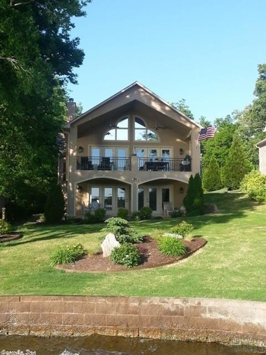 REDUCED! SELLERS MOVING!Main Channel Spectacular Location and Priceless View!!! Quality through-out, featuring Massive windows on the lakeside, 3 bedroom, 2 &1/2 bath, fireplace, wet bar, beautiful kitchen with all appliances, upper and lower living room areas, dining area, upper and lower lakeside covered patios, 2 car garage, covered boat dock and basement storage.