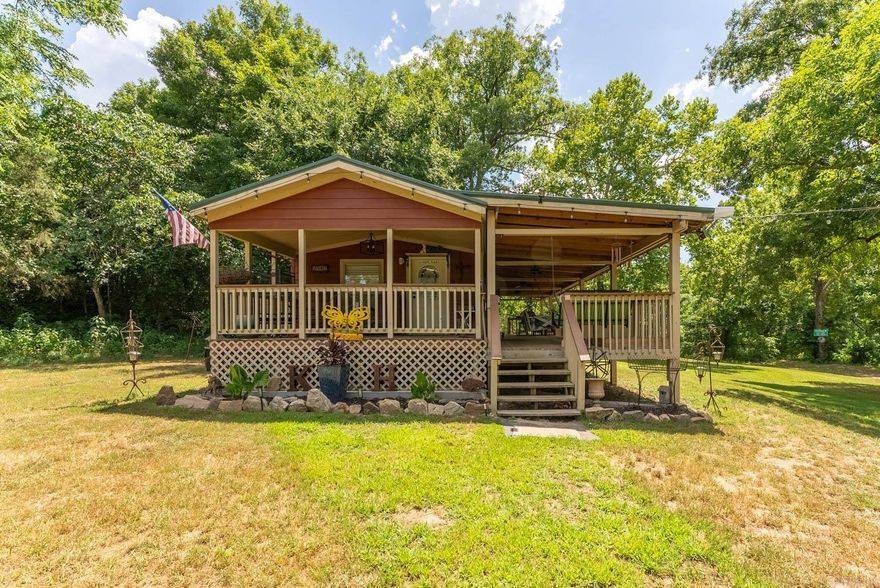 Don't miss this amazing property located on the banks of Clear Creek! Property features 5,000 feet of year round creek frontage with breathtaking views of the beautiful bluffs and waterfalls. Property has a great swimming hole and good fishing! Home includes 1 bedroom, 1 bath, nice open concept for living, dining and kitchen, 600 sq ft of covered deck to help you relax and enjoy your perfect view! Home is furnished and ready for you to set up your vacation spot, AirBNB, or forever home! Property includes private well, septic, 2 sheds, 4 RV hookup's with room for many more! Could be a great income opportunity! Be sure to call and set up your private showing as this property will not last long!