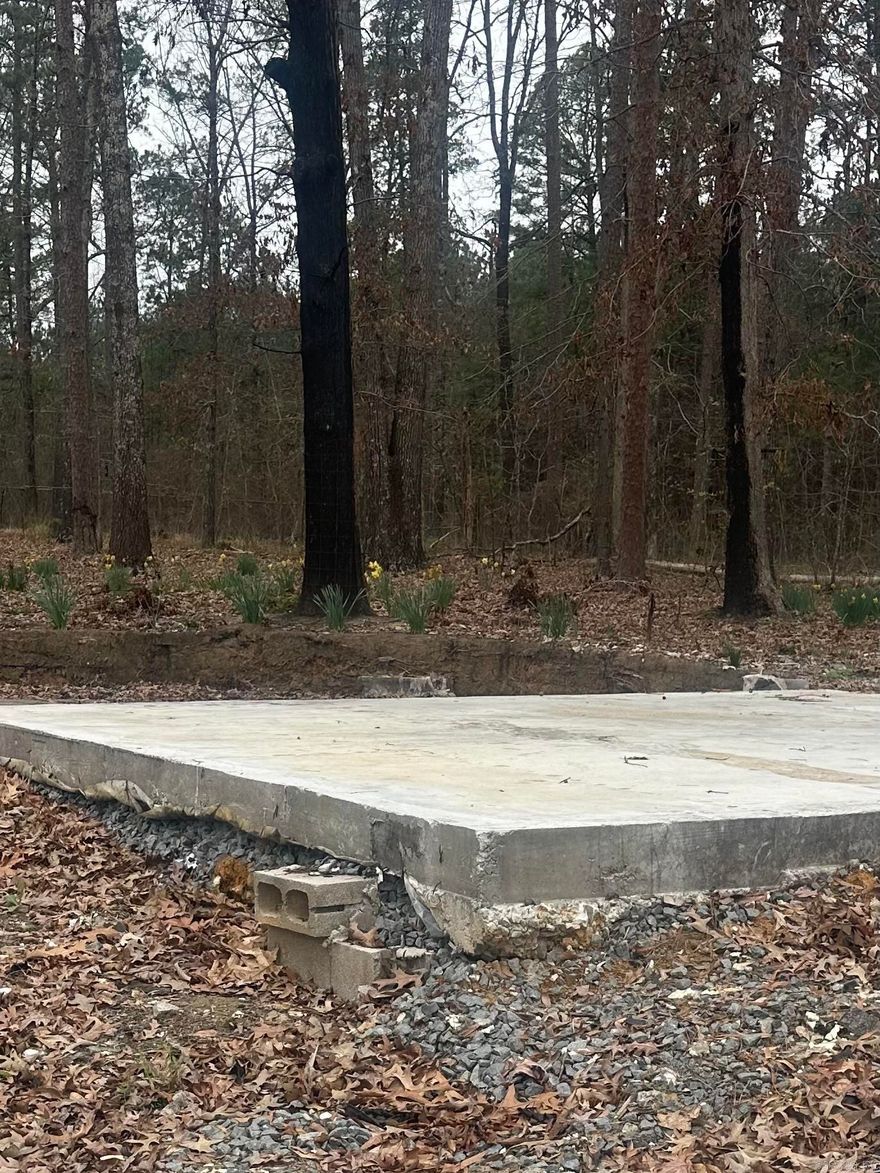 Perfect place to build your home. Slab and basement slab on property.