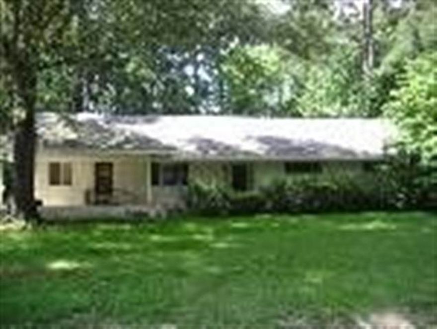 Well constructed 4BR home in Dollarway.  Property includes 2 lots---one the house is sitting on and one next to house.  Beautiful hardwood floors, formal living room, large den, floored attic and large work shop.  ALARM .