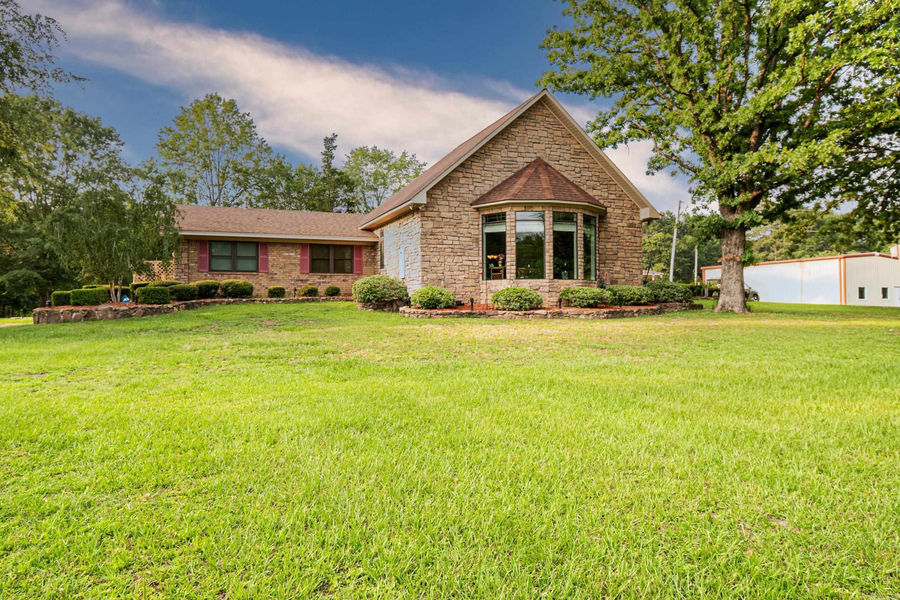 This stunning 4-bedroom, 3-bath home offers nearly 5,000 square feet of thoughtfully designed living space, nestled on 2 beautiful acres. From the moment you walk in, you’ll fall in love with the heart of this home—an incredible open-concept kitchen, living, and dining area that’s perfect for both everyday living and entertaining. The chef’s dream kitchen is fully equipped with gorgeous granite countertops, a gas range, pot filler, double ovens, two pantries, two sinks, two dishwashers, and even instant hot water at the sink. You’ll find no shortage of storage or style here! This home also features a cozy sunroom, a spacious game room, and a dedicated office space—ideal for today’s flexible lifestyle. Outside, enjoy the peaceful setting and extra space with a storage building and room to roam. This one has it all—space, functionality, and luxury touches. A true must-see!
