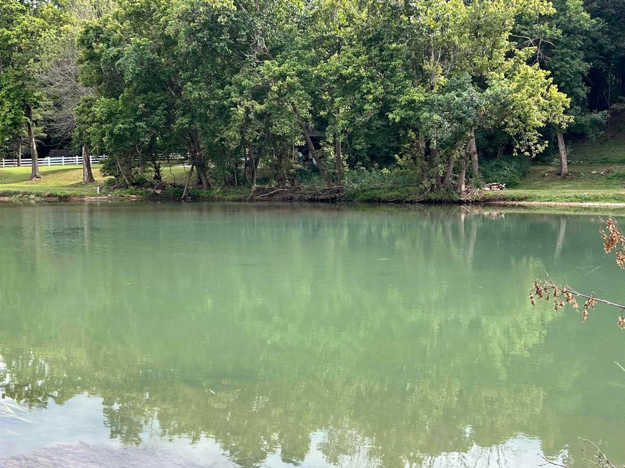 Spring Riverfront Lot in Mammoth Spring, Arkansas  Discover the beauty of the Ozarks with this rare Spring River lot on Riverbend Road in Mammoth Spring, Arkansas. With 89 feet of direct frontage, it’s ideal for camping, fishing, picnicking, or simply relaxing at the water’s edge. A level riverside area makes the perfect campsite, while the wooded hilltop above offers a future homesite with the potential to clear for breathtaking river views. Easy access is provided by city street frontage, giving you convenience alongside privacy and scenic beauty.  Just minutes from Mammoth Spring State Park and one of the world’s largest natural springs, this location offers year-round recreation. Enjoy trout fishing, floating, or exploring the Spring River’s crystal-clear waters. Local dining, shopping, and the historic Frisco Depot Museum are nearby, while public lands and Mark Twain National Forest provide endless hiking and hunting. Across the state line, Thayer, Missouri, adds small-town conveniences, with larger towns like West Plains an easy drive. Whether for recreation, investment, or a future homesite, this property offers a rare chance to own your piece of Spring River living.