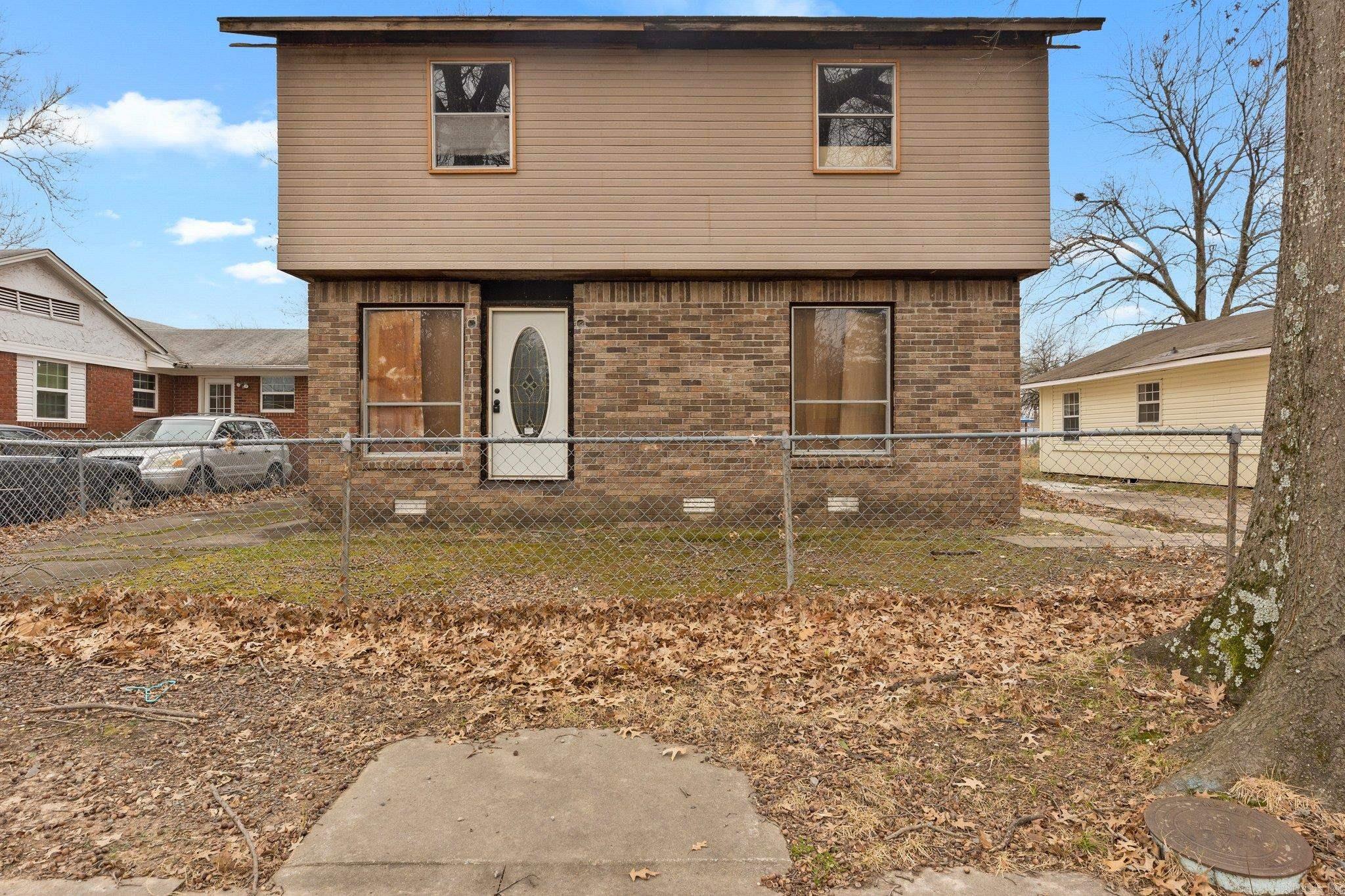 Discover the potential in this spacious 4-bedroom, 2-bathroom home, offering 2,072 sqft of opportunity! Already gutted, this property is a blank canvas, perfect for investors or DIY enthusiasts looking to fix and flip or create a rental masterpiece. With ample space and a desirable layout, it’s primed for transformation. Located in a promising neighborhood, this home is a chance to bring your vision to life and capitalize on the growing market. Don't miss out on this ideal project!  1406 Vine St and 1410 Vine St can also be sold as a package deal for $165,000 total!