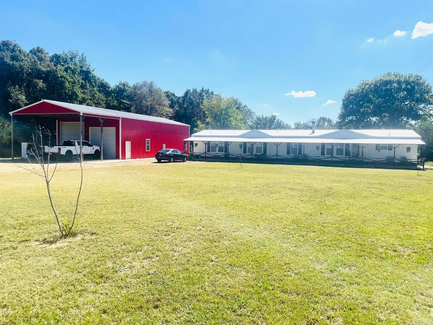 A spacious 4 Bedroom, 3 Bath Home on 10.69 Acres with Shop & Pool. This custom Deer Valley Orchard modular home sits on 10.69 acres of both cleared and wooded property, offering privacy, space and endless possibilities to enjoy. The home features 4 bedrooms and 3 bathrooms, including a master suite with a walk-in shower and oversized soaker tub. A cozy fireplace, quartz countertops, double oven, farm sink, and a convenient mudroom/laundry room. A 30x60 shop with electricity featuring 12x14 and 12x12 doors offering ample room for hobbies, storage or business venture. Also, a 30x20 covered carport, 9x40 deck, 10x90 covered porch and a saltwater pool perfect for relaxing or entertaining. This home is set on a permanent foundation with brick skirting, combining durability with comfort and plenty of space to enjoy both indoor and outdoor living.