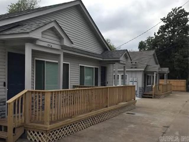 Investors take notice. This listing includes 2 duplexes adjacent to one another and the parking lot next door. Completely remodeled in 2022. Each are 2 bedroom, 1 bath units. All units have their own laundry. There is parking pads for each unit. There is a common back yard. These units have previously been utilized as short term rentals. With the current zoning there is a possibility the permits may be obtainable for future use. Located across from the Majestic Park. All units are currently rented for $1,200 a month. Some have previously rented for $1,500. Situated between bathhouse row and Oaklawn. Appointments required. Please do not disturb tenants.