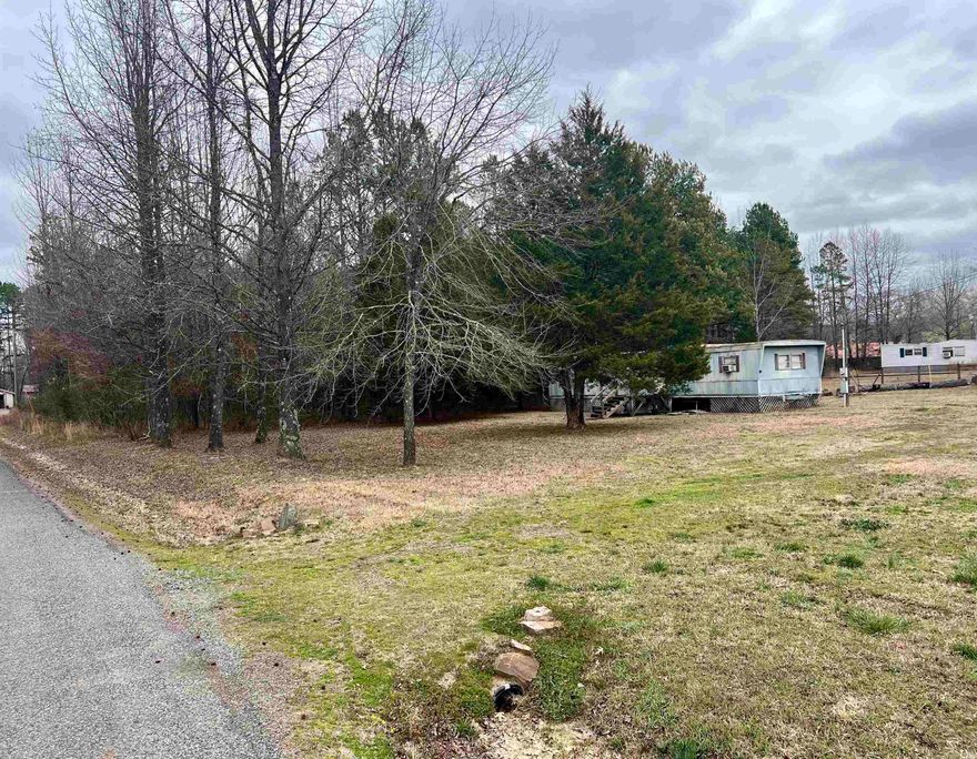 .50 acre lot with utilities established, 1970 mobile and all contents convey. Minutes from Lobo Landing on the Little Red River and just 8 miles to Greers Ferry Lake.