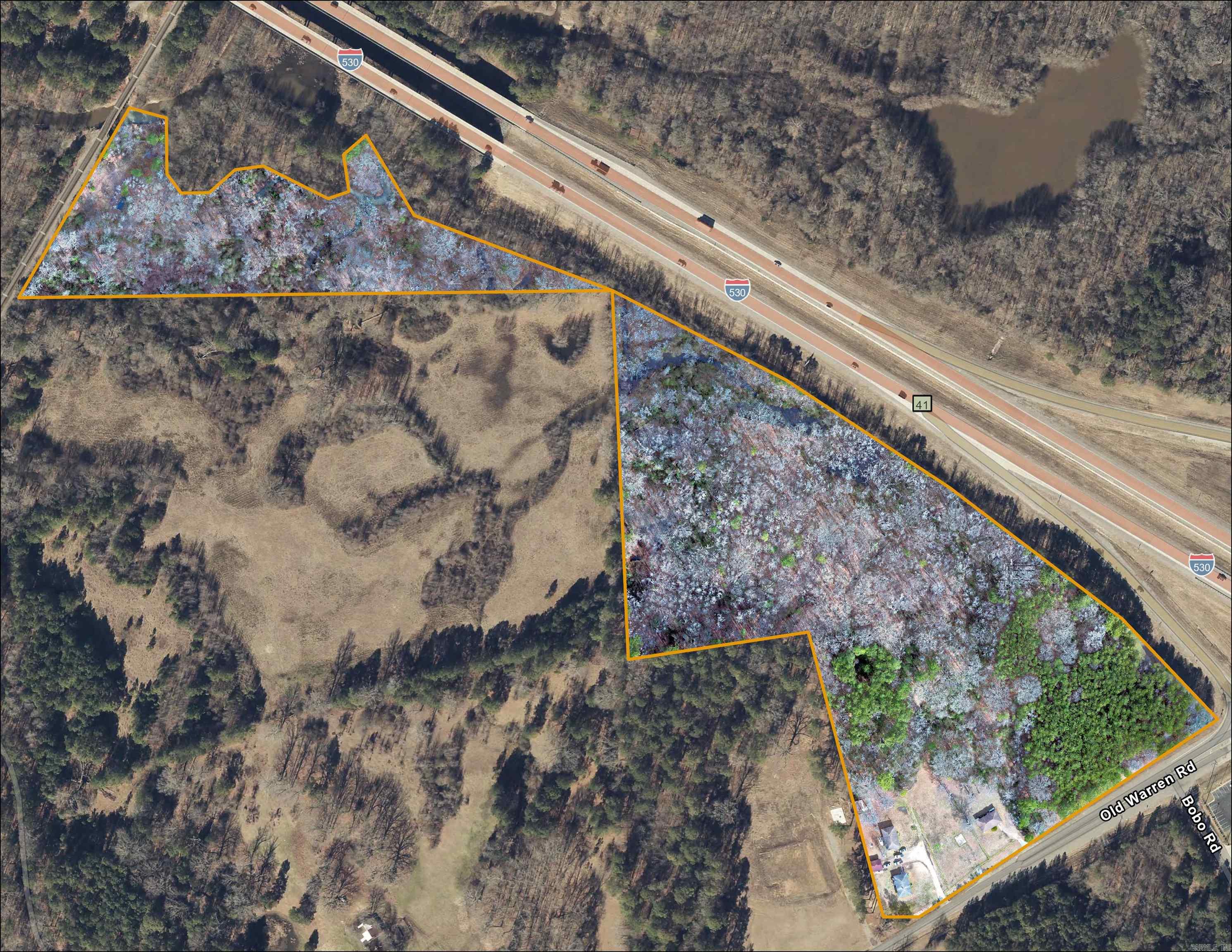 Approximately 10-12 acres of high useable ground on corner (not in flood plain area). Excellent Interstate frontage and visibility, with easy access. Prime commercial land at a super price! Highest traffic count in City at 30,000 cars/day. All utilities available including new fiber optic line.