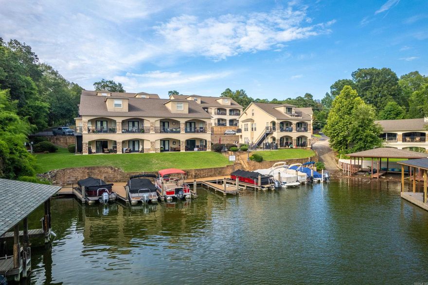 Discover the perfect blend of tranquility and convenience in this beautifully maintained 3-bedroom, 3-bath lakefront condo nestled in a peaceful cove just off the main channel of Lake Hamilton. Located in one of Hot Springs’ most sought-after areas, this property offers its own boat slip, serene water views, and a quiet, family-friendly environment ideal for both full-time living and weekend getaways. Step inside the living space filled with natural light, featuring a spacious kitchen, generous bedrooms, and a private balcony perfect for enjoying morning coffee or evening sunsets over the water. The upstairs touts plenty of living space for any amount of guests. Whether you’re entertaining or relaxing, you’ll love the calm setting with no through-traffic and minimal boat wake, making it ideal for swimming, kayaking, or simply unwinding lakeside. This is lake life at its most peaceful—close to everything, yet a world away. Don’t miss your chance to own a slice of paradise on Lake Hamilton.