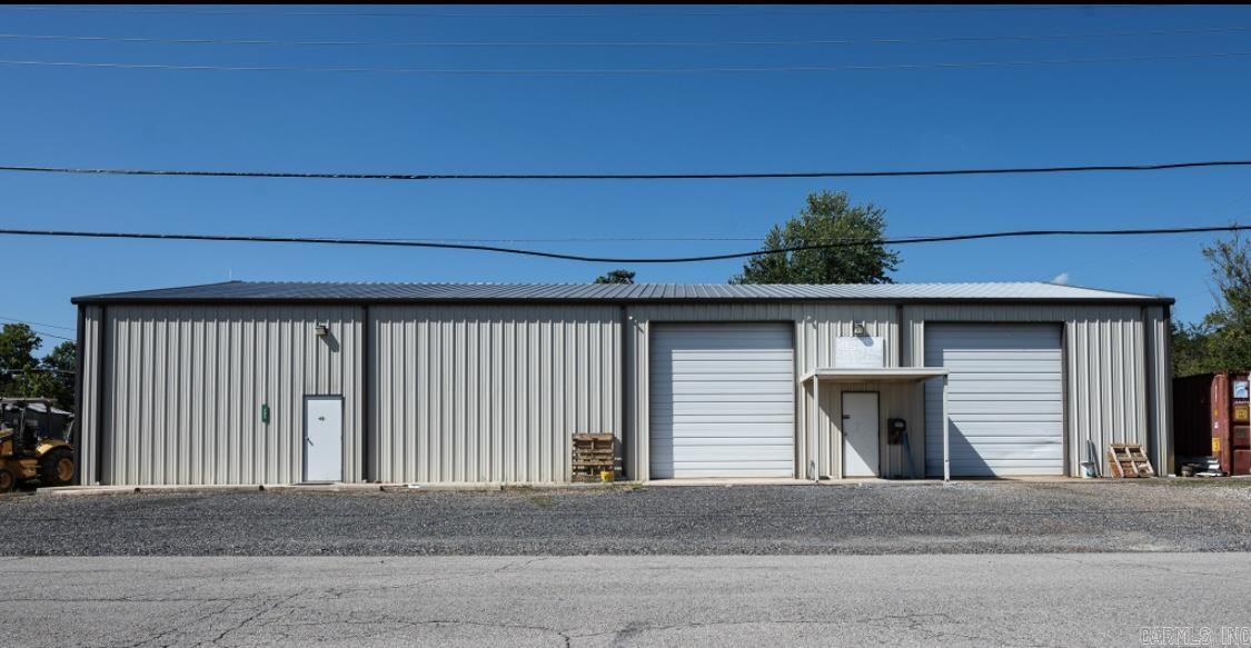 Located in the heart of Mena, Arkansas you'll find this spacious multiuse building sitting on a nice level 100 x 140 lot waiting on your new business. Building in excellent condition offering heat and cooled offices and work space, 2 rest rooms, nice show room, work area, mezzanine, over head doors, loft for storage or additional offices or living quarters. Endless possibilities. Covered entrance, front sidewalk, gravel parking. Adjacent to well known machine shop in Mena. Call for more information.