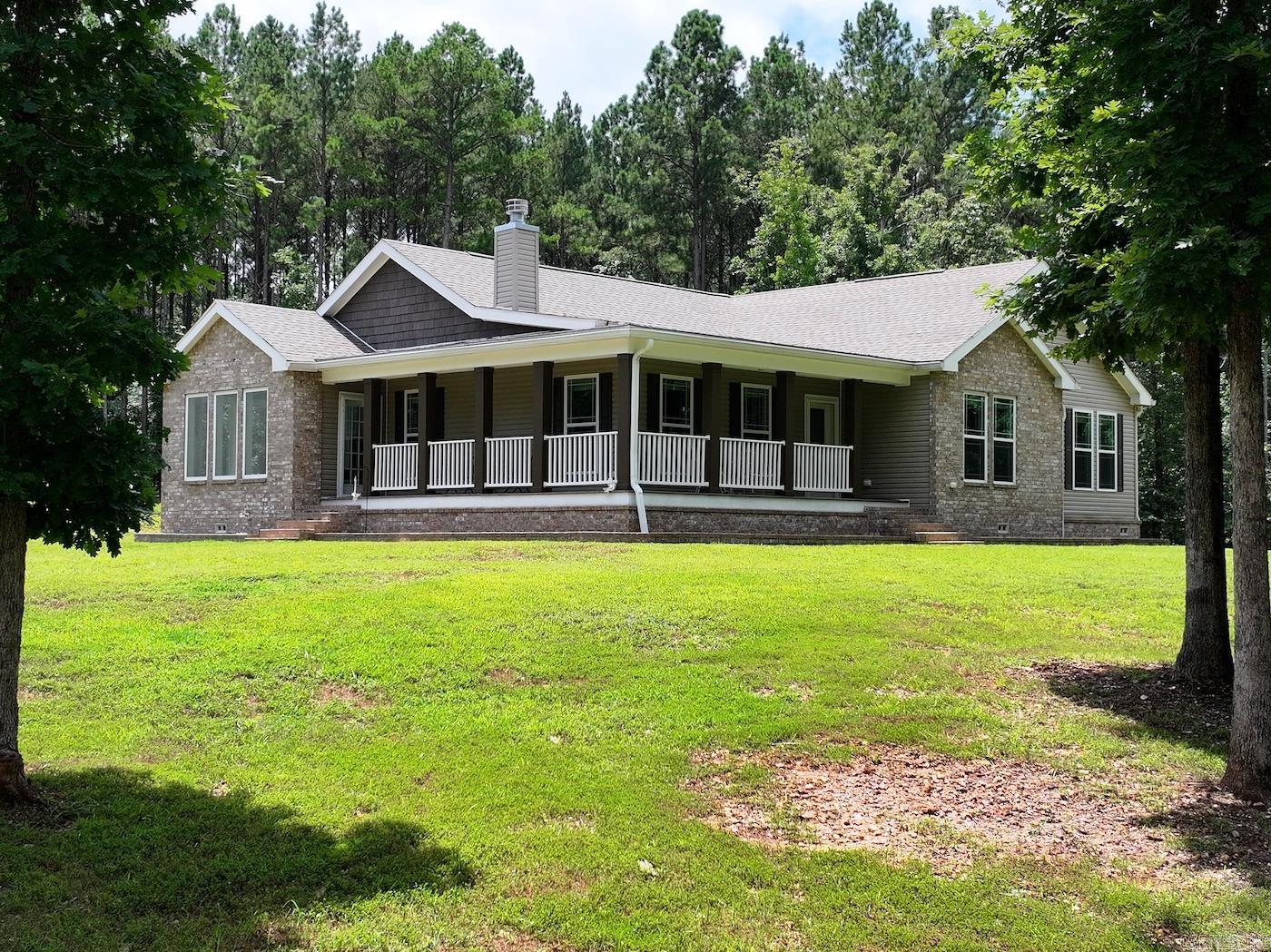 This 3-bedroom, 2-bathroom, 2,670 sq ft home is only 4 years old and is like new! It sits on 49.93 +/- acres offering a beautiful creek and natural beauty. Featuring a 50 x 50 shop with a 20' ceiling, with 200 amp service, an extra 20 foot slab with electric and water hook ups. Plenty of room to roam, hunt, dig for crystals, etc. This is a great property for investment or long term home. It has endless potential and is a must see!