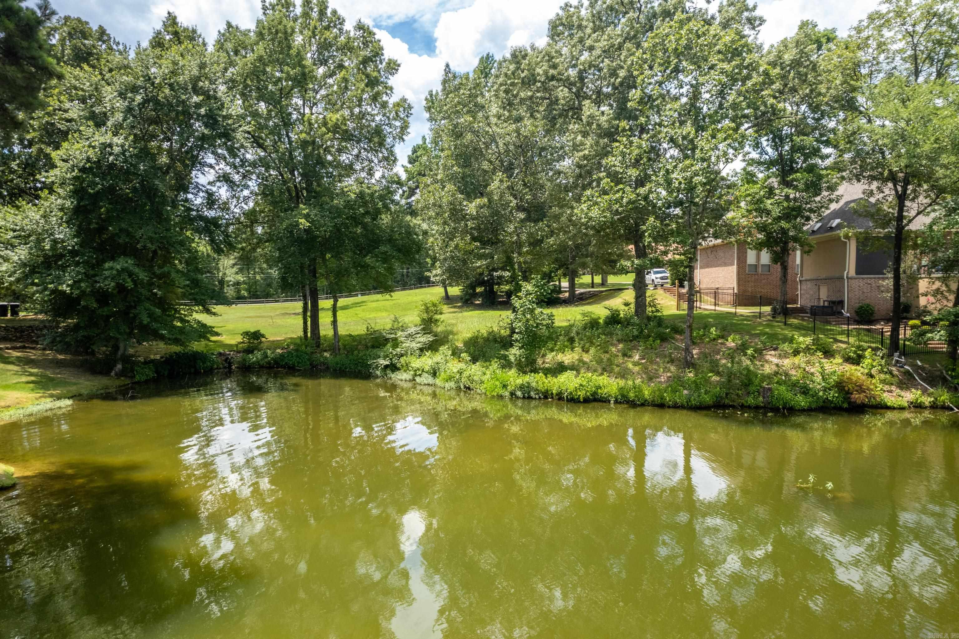 Build your dream home in the prestigious Oak Shores Estates, a quiet community on the banks of beautiful Lake Hamilton. This prime lakefront lot offers breathtaking views and direct water access, with approval already in place for a private two-stall boat dock—an incredible advantage for lake lovers. The neighborhood features a private boat ramp and secure storage yard, making lake living both easy and enjoyable. Enjoy the peace and tranquility of this secluded setting, all while being just minutes from shopping, dining, and entertainment in Hot Springs. Whether you're planning a full-time residence or a weekend retreat, this is a rare opportunity to own lakefront property in one of the area's most desirable communities. Don't miss your chance to build the lakefront lifestyle you've always wanted.