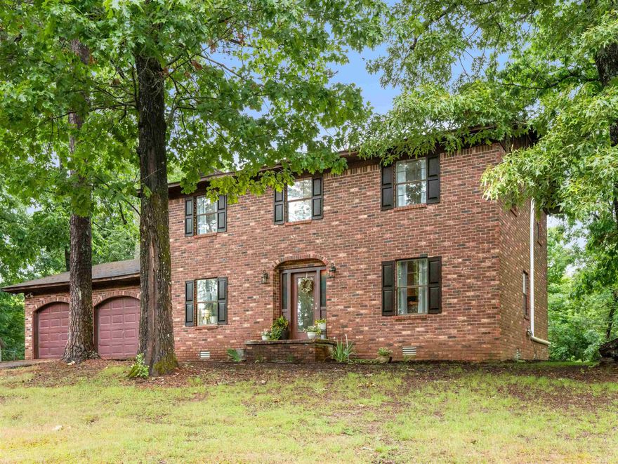 ONLY 15 MINUTES FROM LAKE OUACHITA! Follow the meandering drive to a picturesque 5 acre property located just off the beaten path. This 4 bed 2.5 bath 2 story brick home with love poured into in the recent remodel has cheery touches & a modern farm-house feel! The sellers' attention to detail shines! The main level has a spacious living-room with beautiful brick fireplace, a completely remodeled kitchen, a dining-room, a full bath, a laundry room, & a family room that could easily be converted to a main-level bedroom.  The cozy upstairs has 4 roomy bedrooms & 1.5 baths for privacy & rest! Outside you will be pleased to find fruit trees like peach, apple, & a fruit cocktail tree, blackberry & grape vines, & blueberry bushes along with  a cute chicken house with laying hens, & wildlife galore like whitetail deer & turkey! Updates include:New roof 2019..New HVAC SYSTEM 2022. 2023-2025..New flooring throughout (LVP & Mosaic Tile in the living areas & carpet in the bedrooms). New plumbing & lighting fixtures. New quartz countertops, kitchen appliances, & cabinetry. New shiplap & baseboard. New vanities & mirrors. New paint throughout. New soffit. New hot water heater. And MORE!!