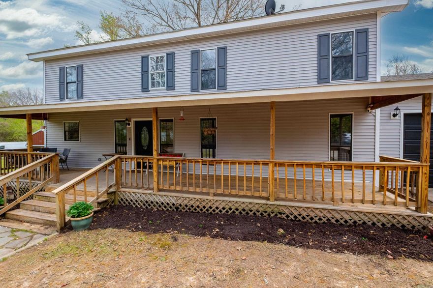 Spacious home offering 3,606 sq ft with 5 bedrooms and 3½ baths on an incredible almost one-acre lot (two lots combined) in a peaceful rural setting off Lawson Rd. Enjoy the large open living and dining spaces, perfect for entertaining. The kitchen was updated in 2024 with a new gas stove, microwave, and dishwasher and features a huge walk-in pantry. Two primary suites provide flexible living—one on the main level and another upstairs—along with three additional bedrooms and two full baths upstairs. Step outside to a backyard retreat with an in-ground pool, outdoor fireplace, outdoor kitchen, seating area, and half bath. The extra-deep two-car garage, wide concrete driveway, and welcoming long front porch add convenience and charm. Very private location near the end of the road with a huge yard offering plenty of room to build a shop. Agents see remarks.